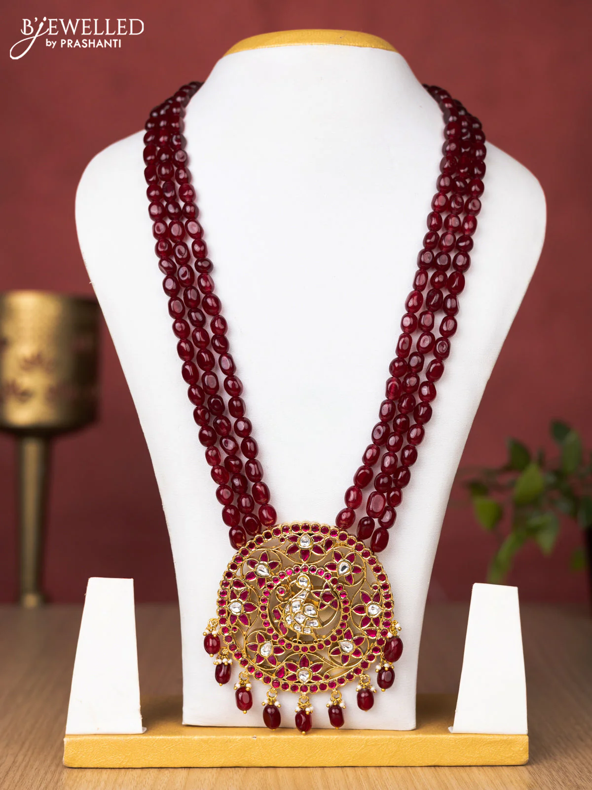 Jadau beaded maroon haaram peacock and floral pendant with jadau pink & kundan stones and pearl & beads hanging without earrings