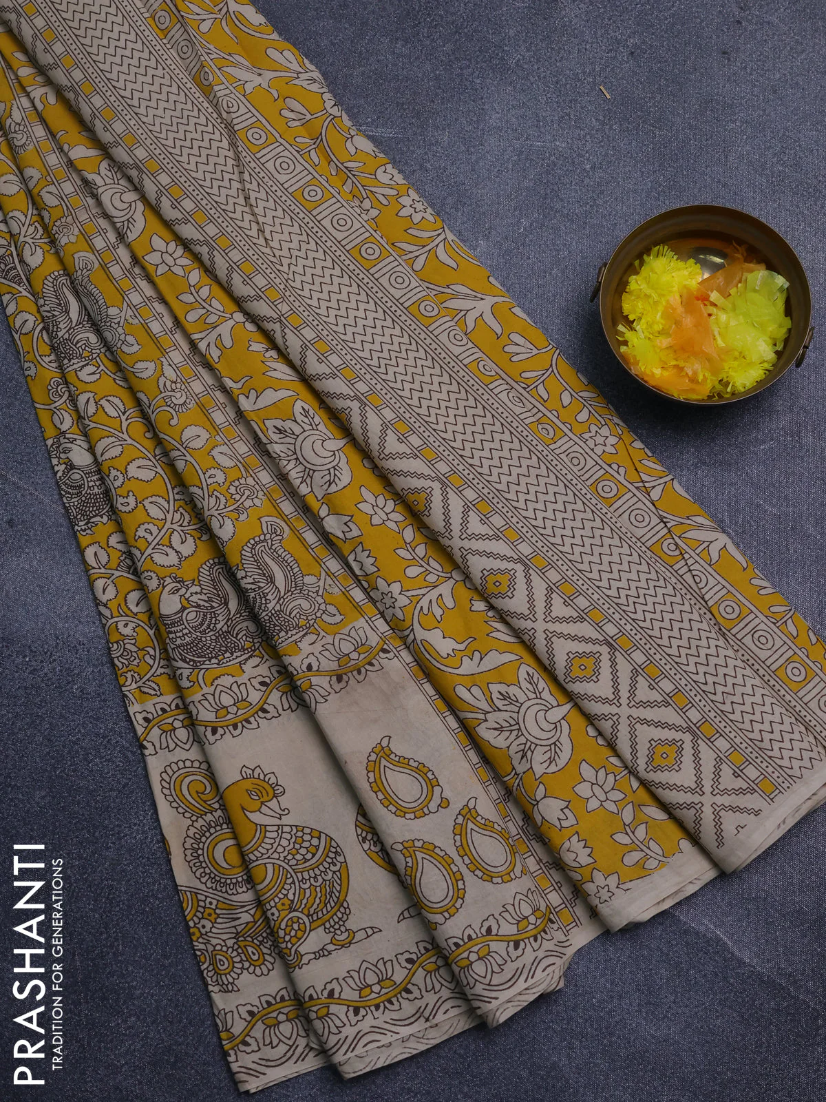 Kalamkari cotton saree yellow and beige with allover prints and long printed border