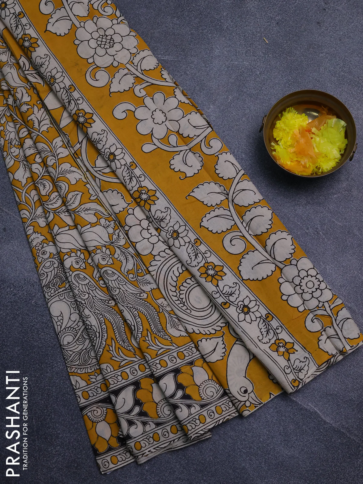 Kalamkari cotton saree yellow and black with allover prints and printed border
