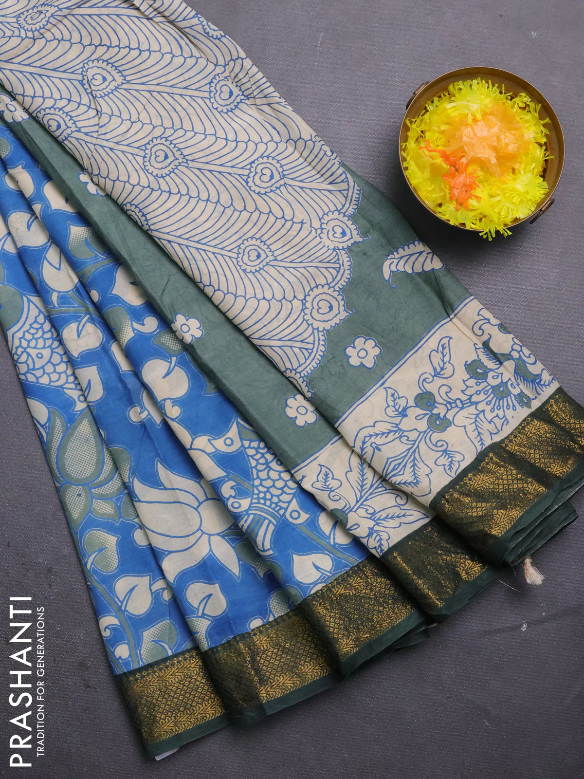 Kalamkari semi silk saree blue and bottle green with allover prints and mangalgiri border
