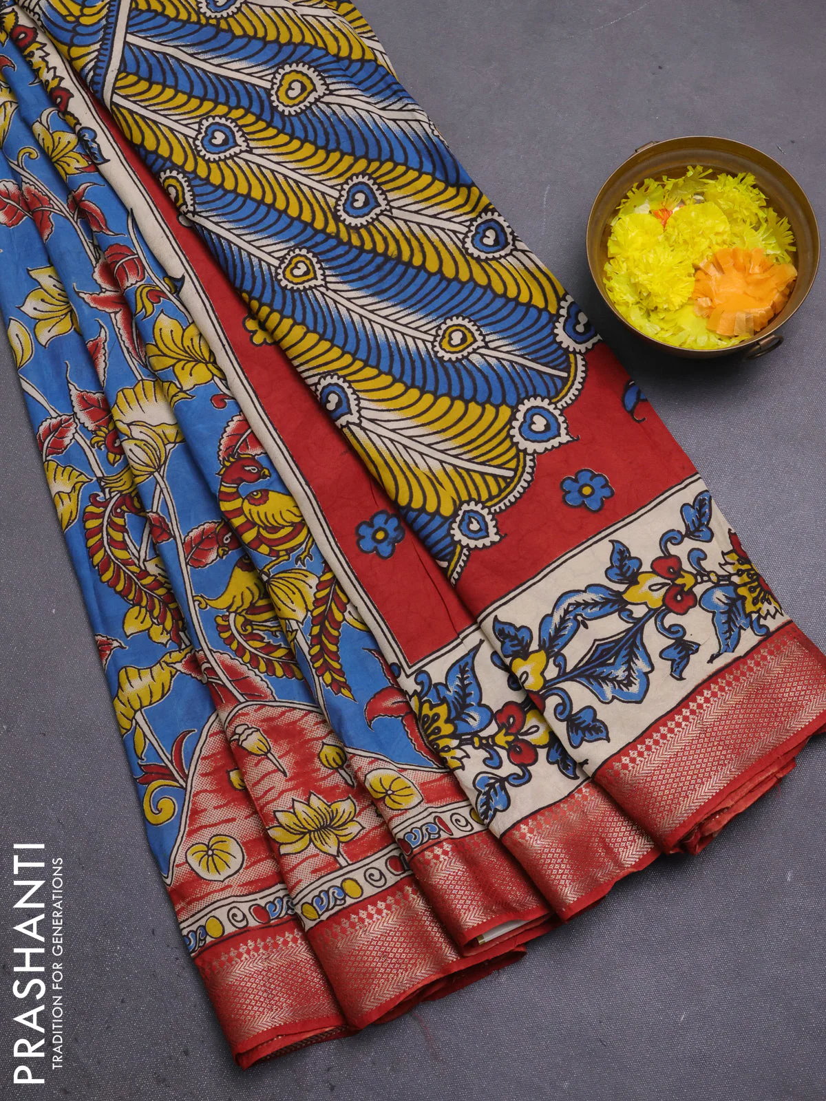 Kalamkari semi silk saree blue and rust shade with allover prints and mangalgiri border