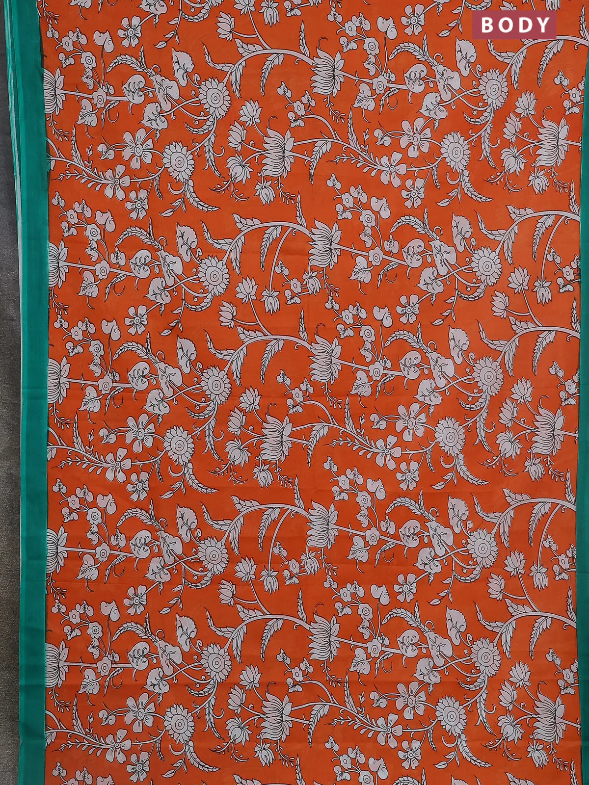 Kalamkari semi silk saree orange and green with allover prints and simple border - Image 2