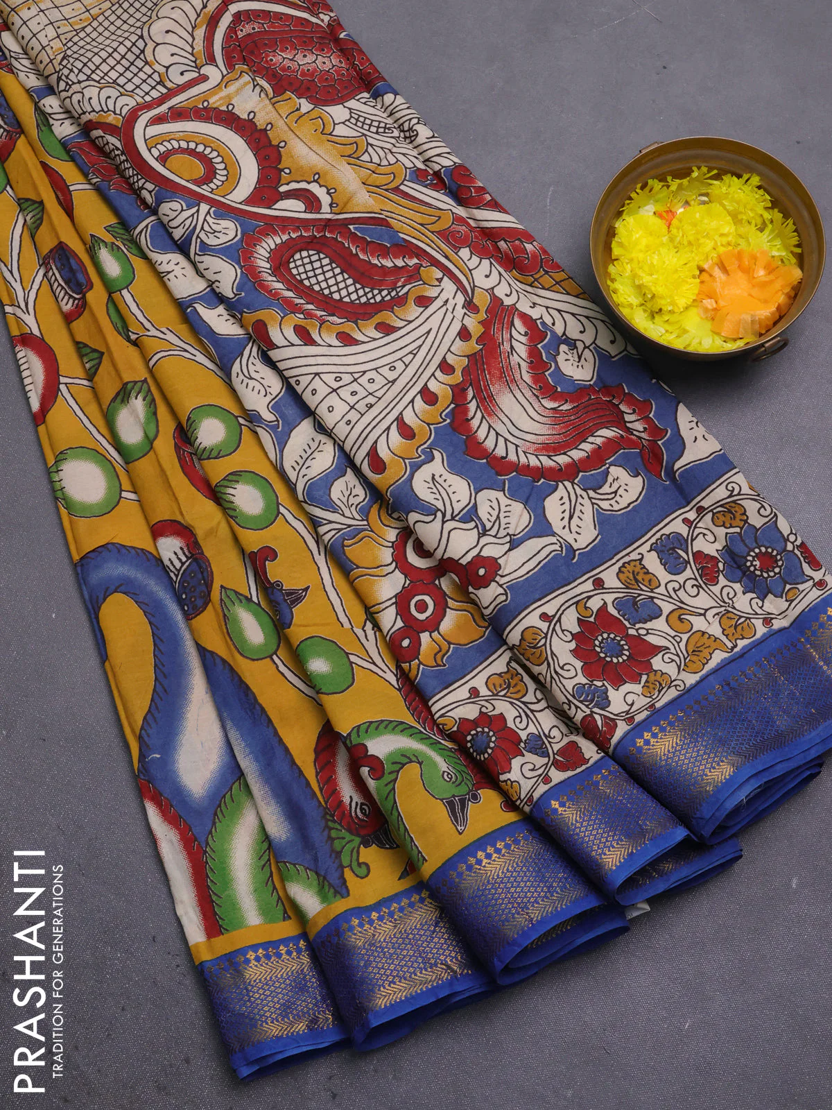 Kalamkari semi silk saree yellow and blue with allover prints and mangalgiri border