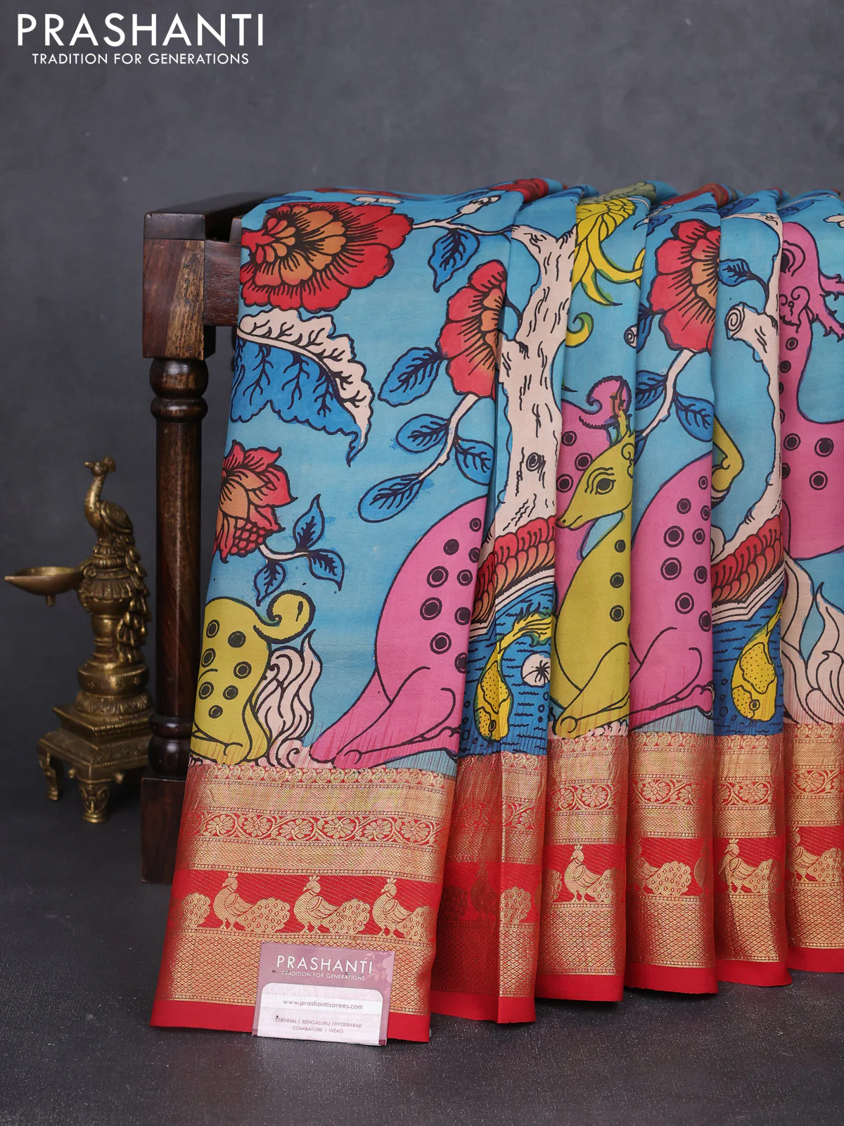 Pure kanchipuram silk saree blue and red with allover penkalamkari prints and rich peacock zari woven border