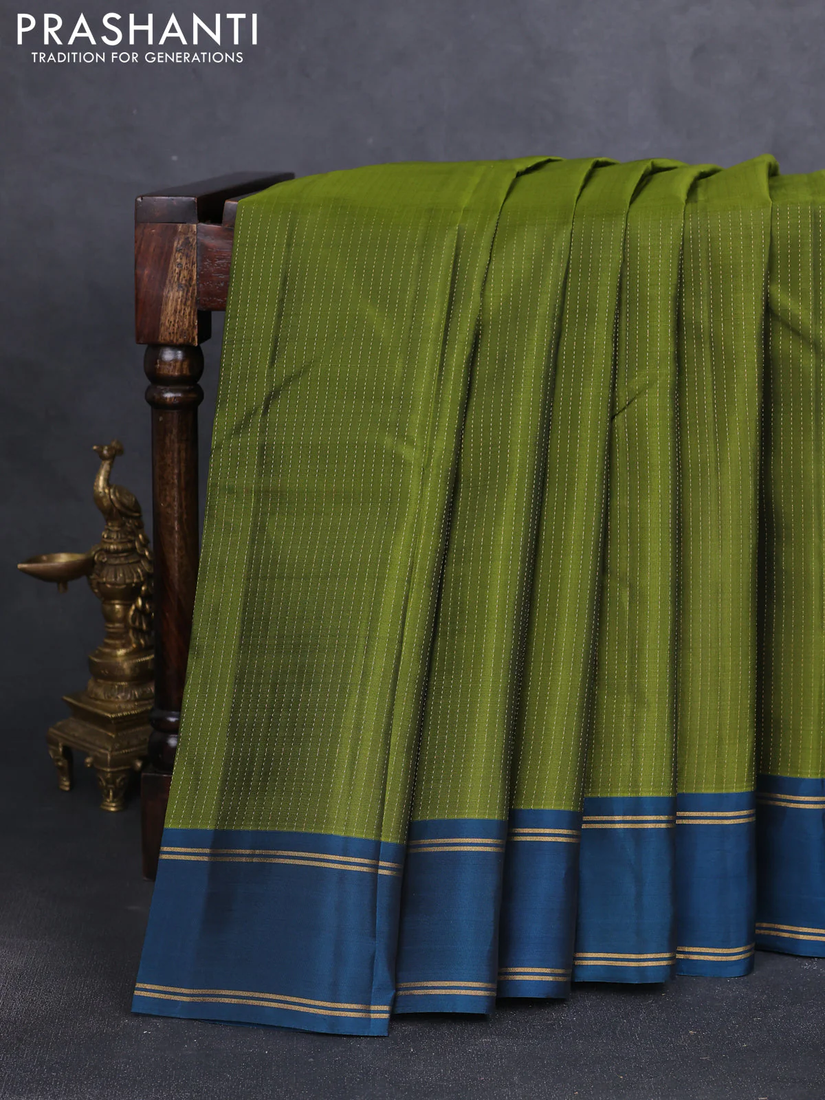 Kanchipuram silk saree mehendi green and peacock green with allover zari strip pattern and rettapet zari woven border