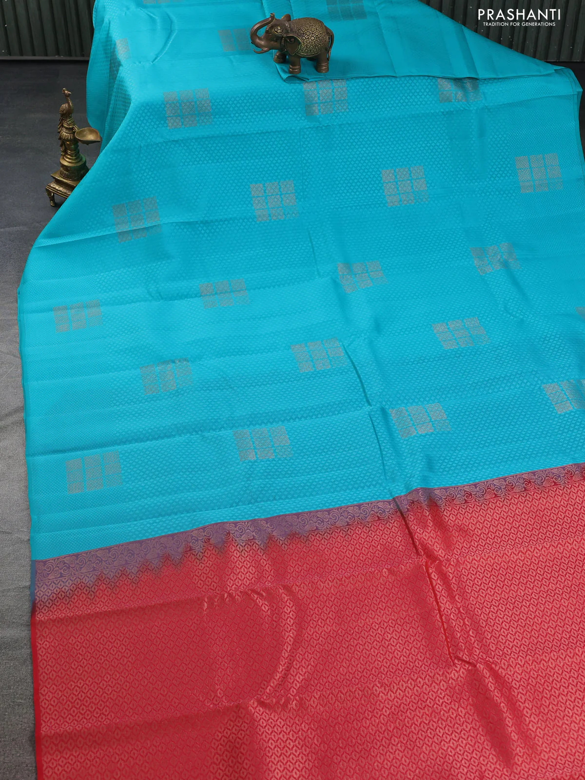 Kanchipuram silk saree teal blue and reddish orange with allover self emboss & copper zari buttas in borderless style - Image 2