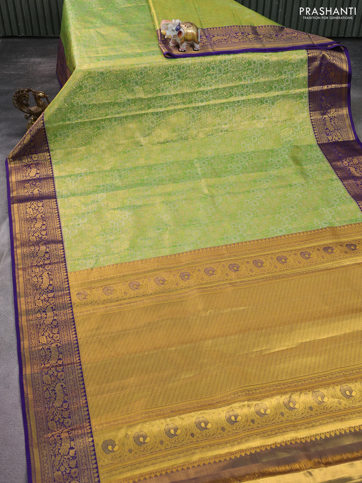 Kanchipuram tissue silk saree light green and blue with allover zari woven brocade weaves and zari woven border - Image 2