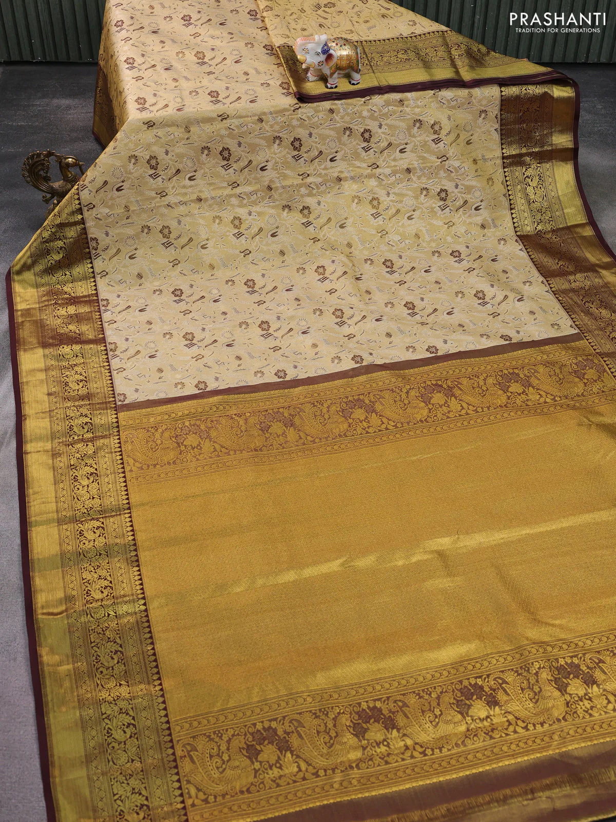 Kanchipuram tissue silk saree sandal and deep maroon with allover zari woven brocade weaves and zari woven border - Image 2