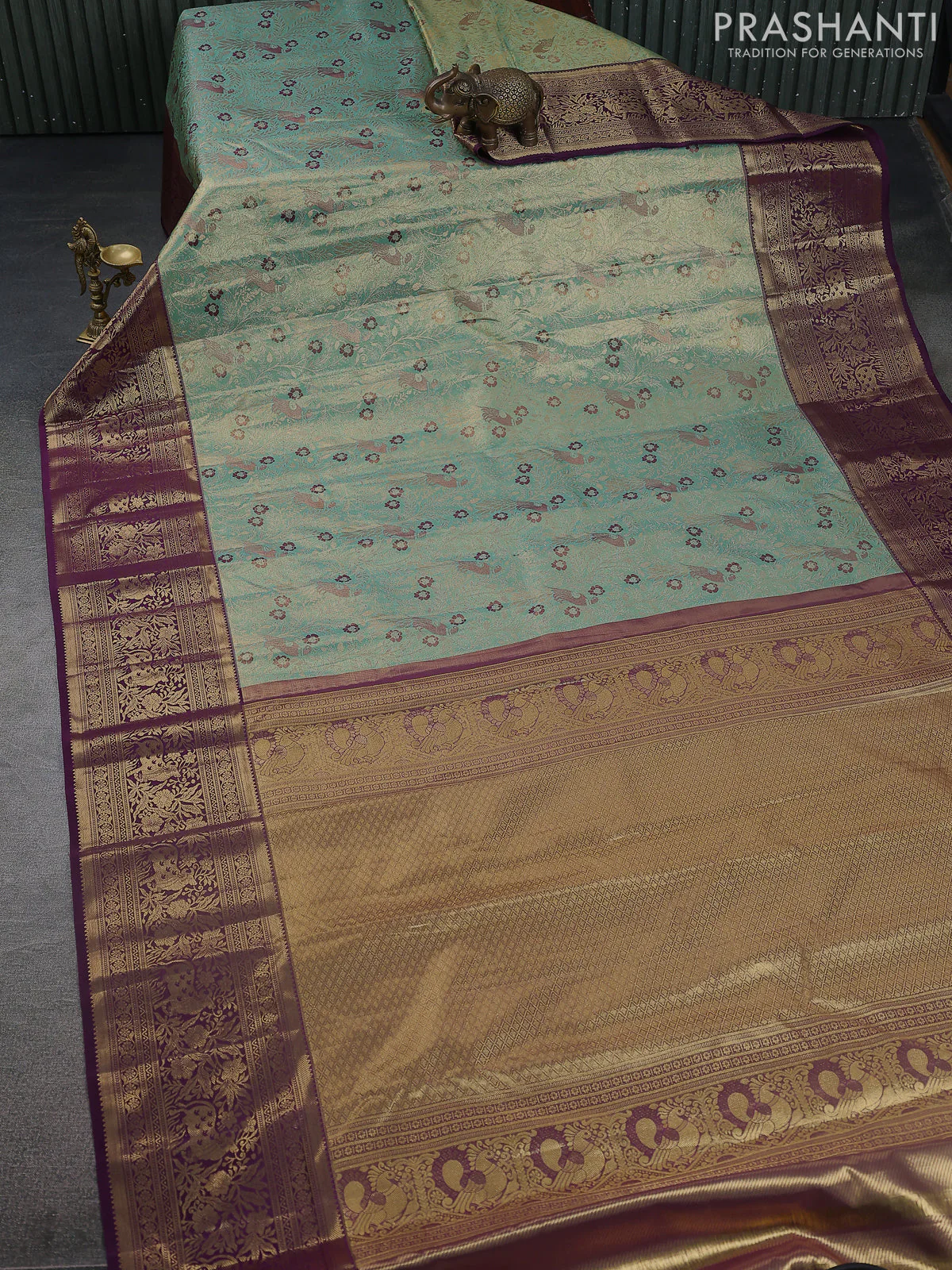 Kanchipuram tissue silk saree teal and wine shade with allover zari woven brocade weaves and zari woven border - Image 2