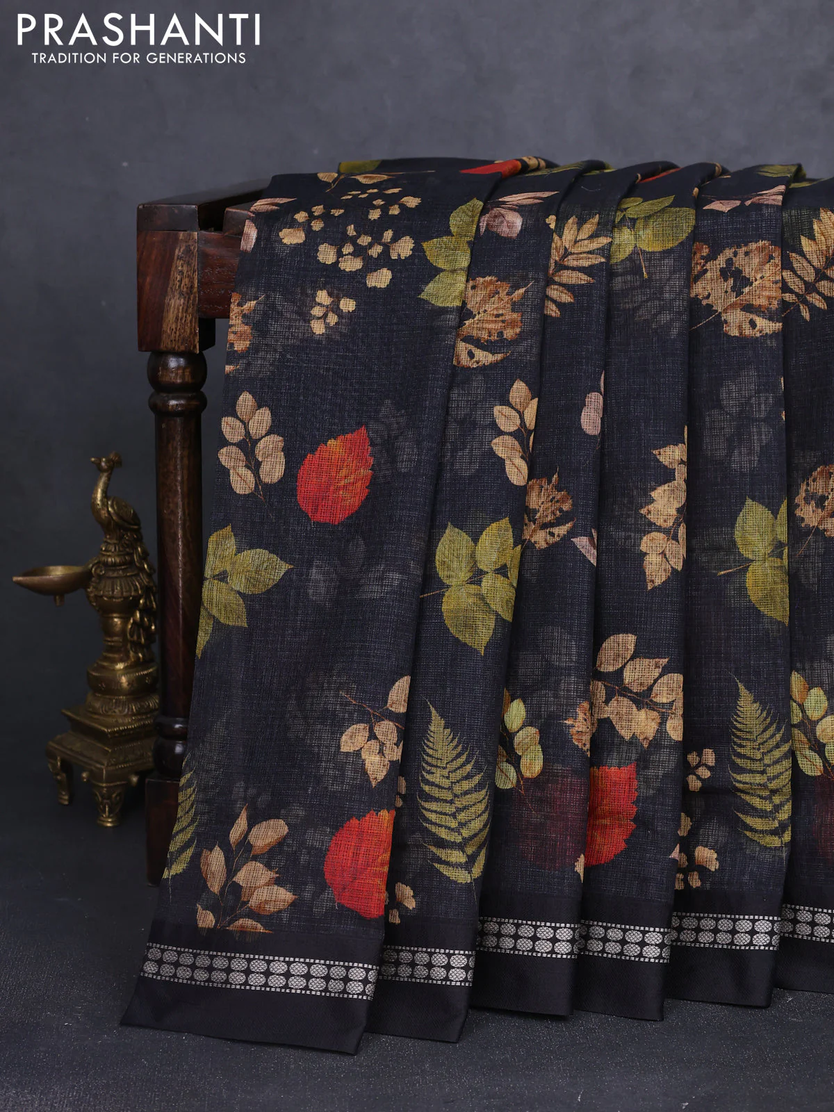 Kota silk cotton saree black with allover leaf digital prints and thread woven border