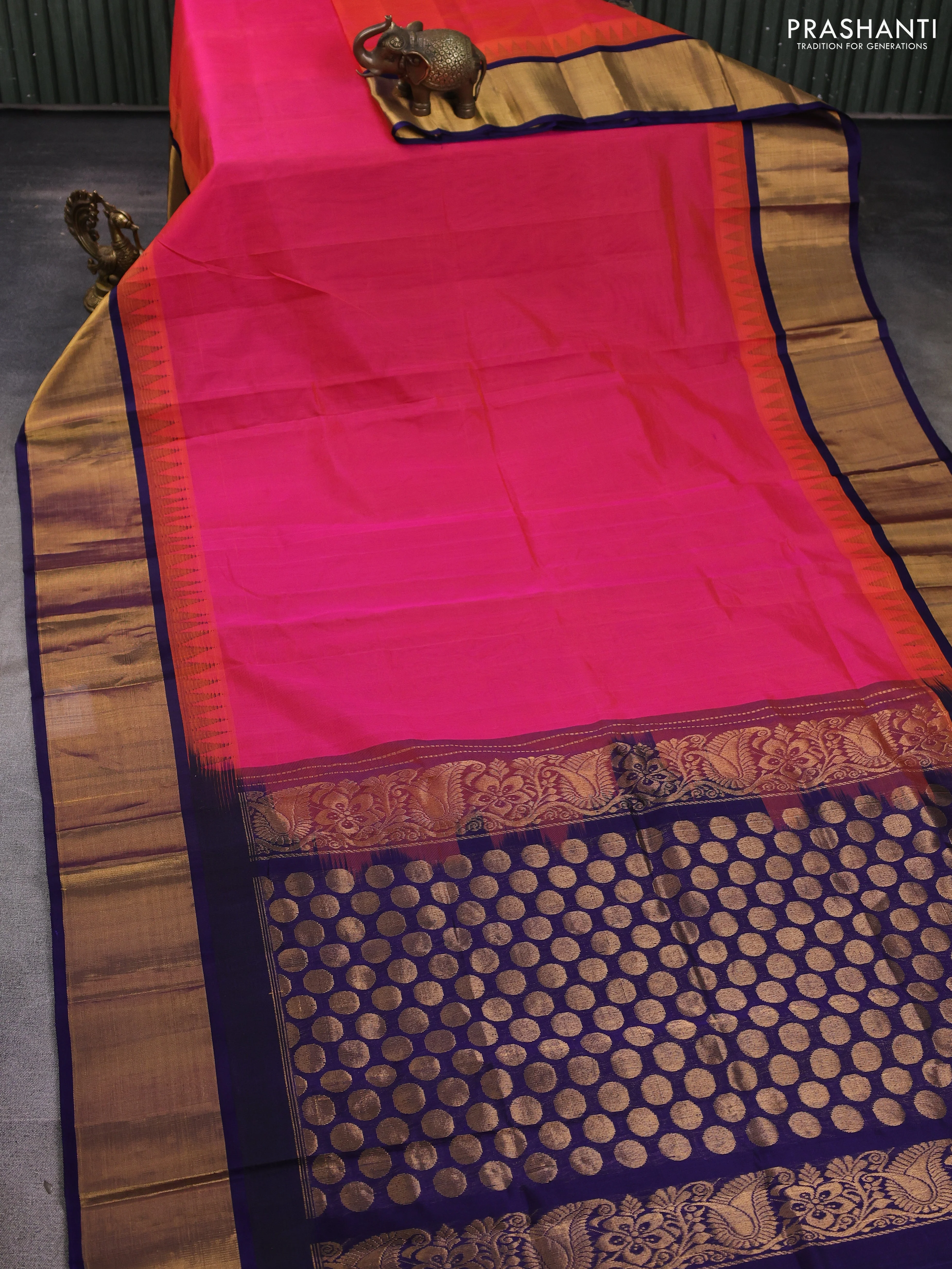 Kuppadam silk cotton saree dual shade of pinkish orange and navy blue with plain body and temple design zari woven border - Image 2