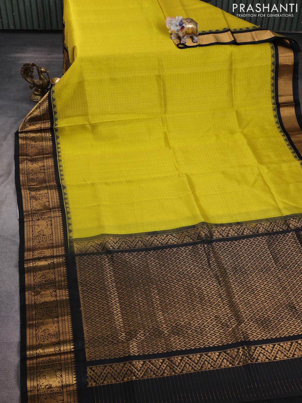 Kuppadam silk cotton saree lime yellow and black with allover laksha deepam pattern and temple design elephant zari woven border - Image 2