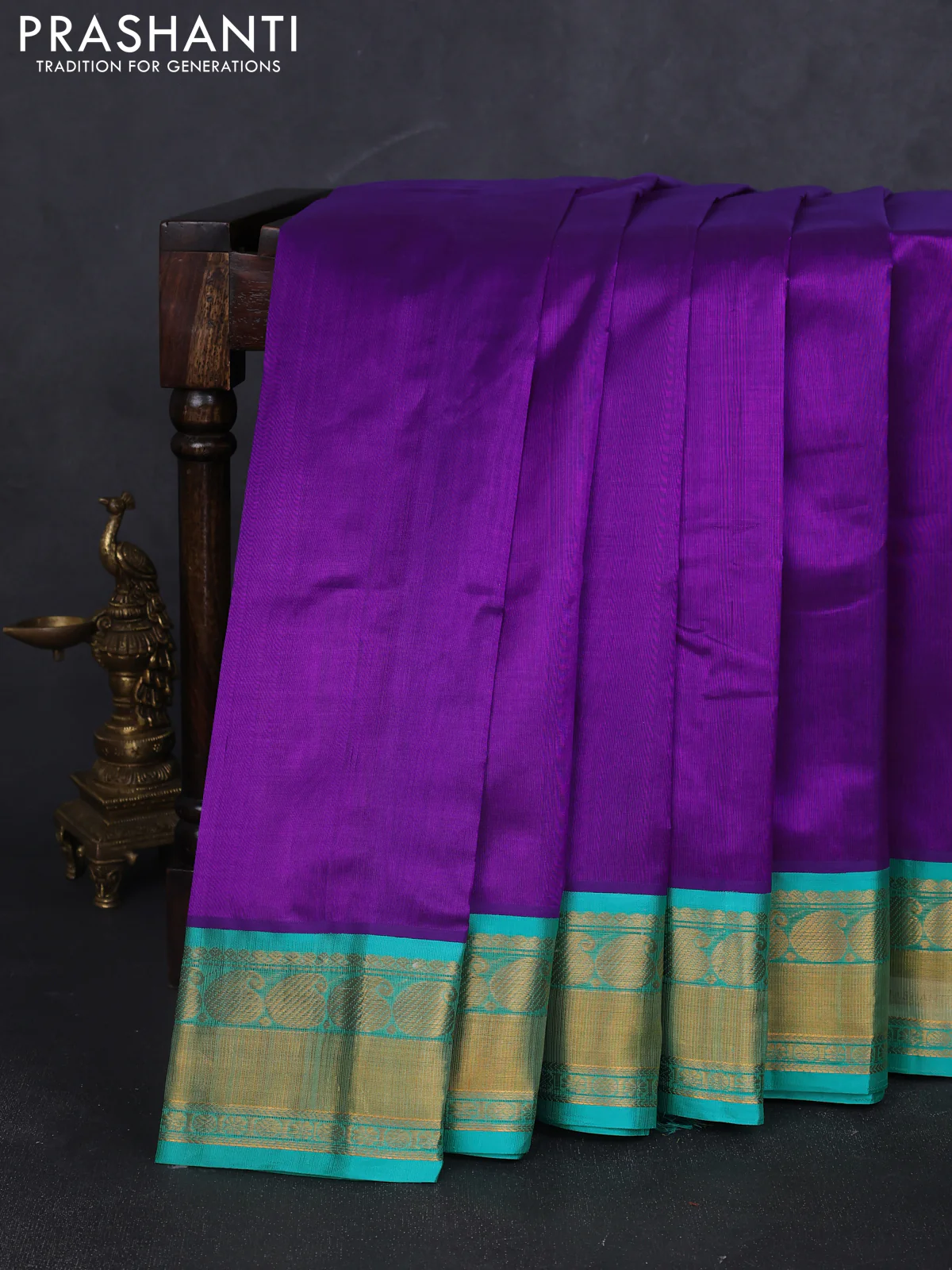 Kuppadam silk cotton saree purple and teal blue with plain body and paisley zari woven border