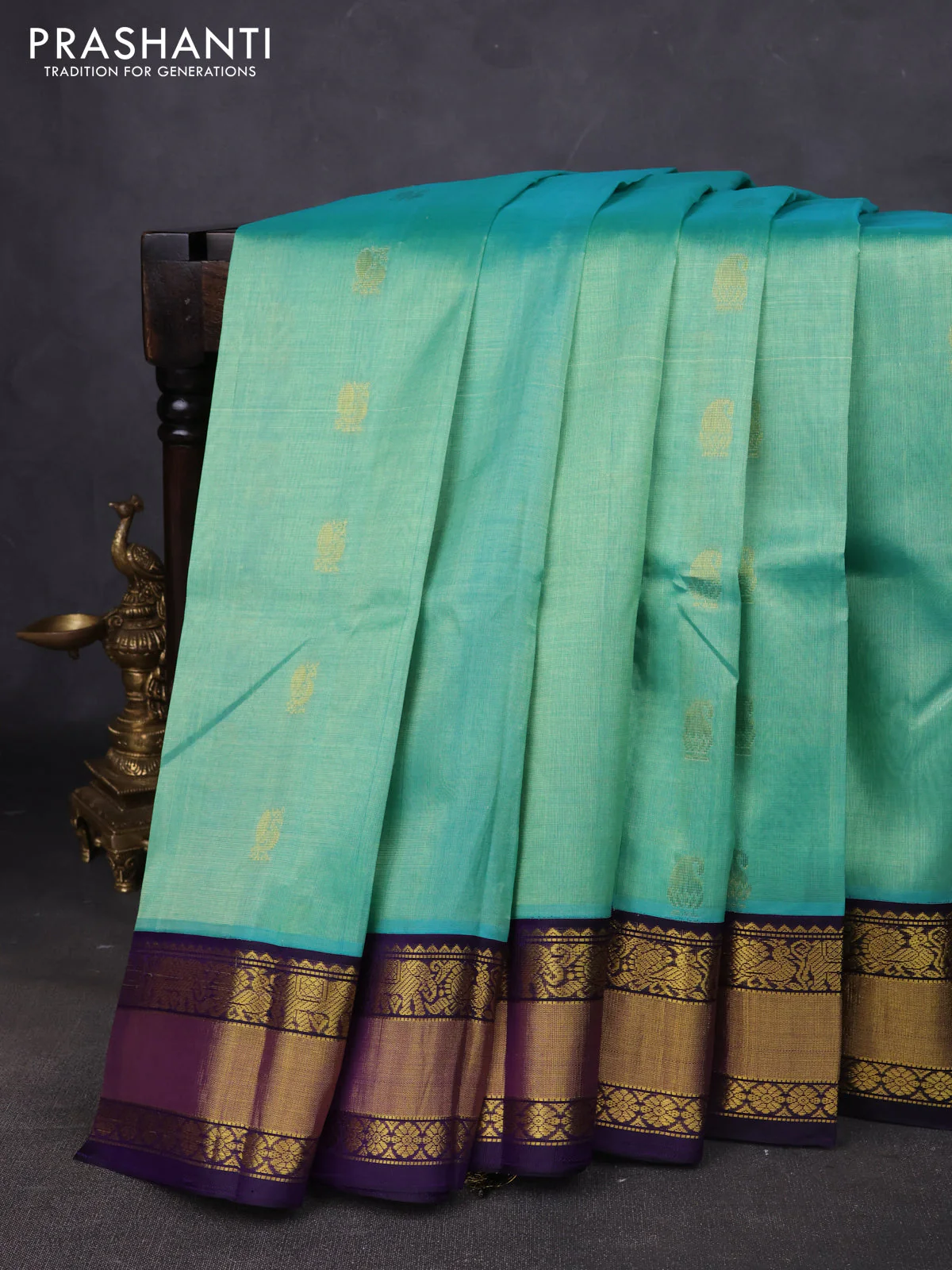 Kuppadam silk cotton saree teal shade and navy blue with annam zari woven buttas and zari woven korvai border
