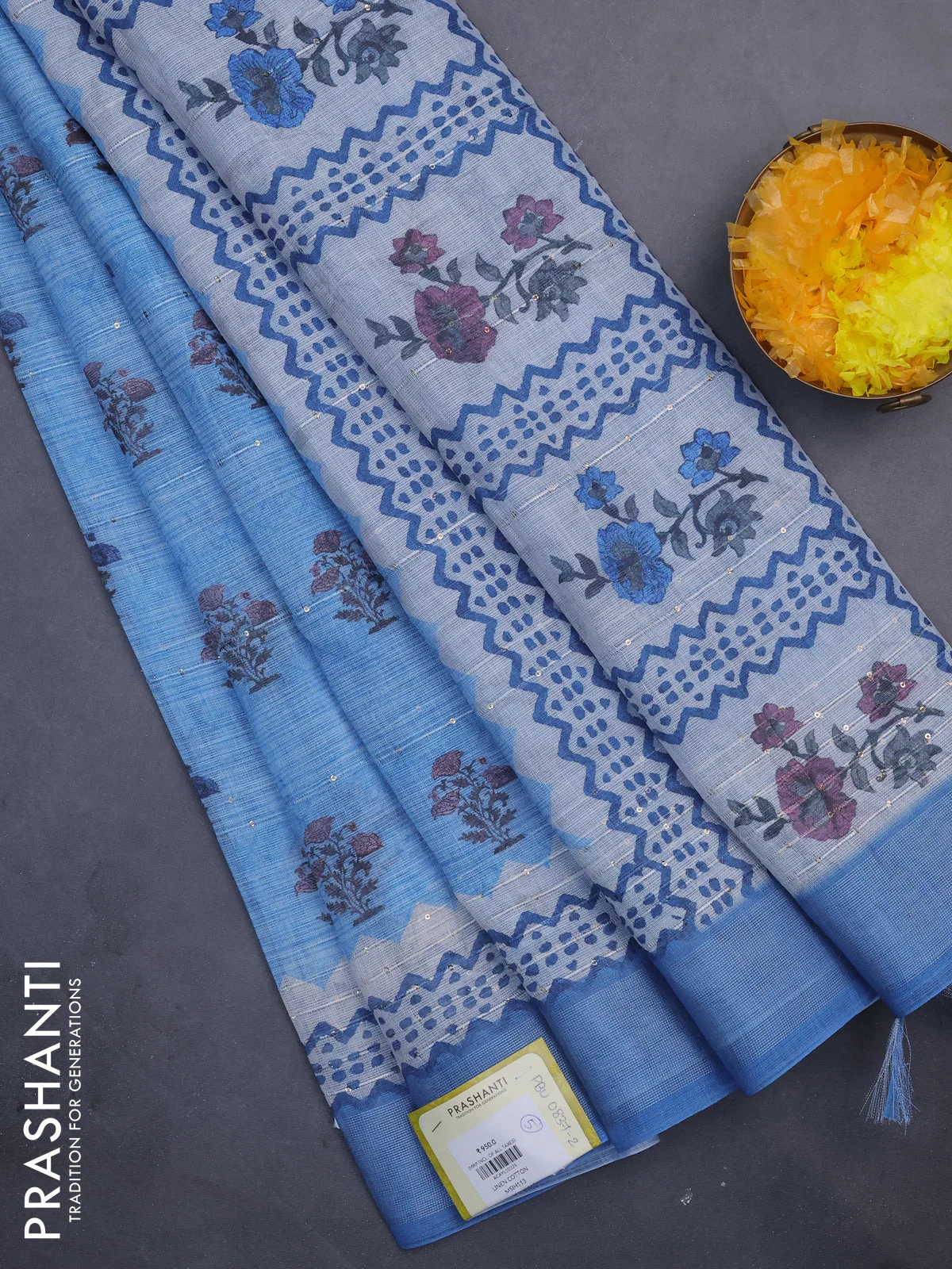 Linen cotton saree blue shade with floral butta prints & sequin work and silver zari woven border