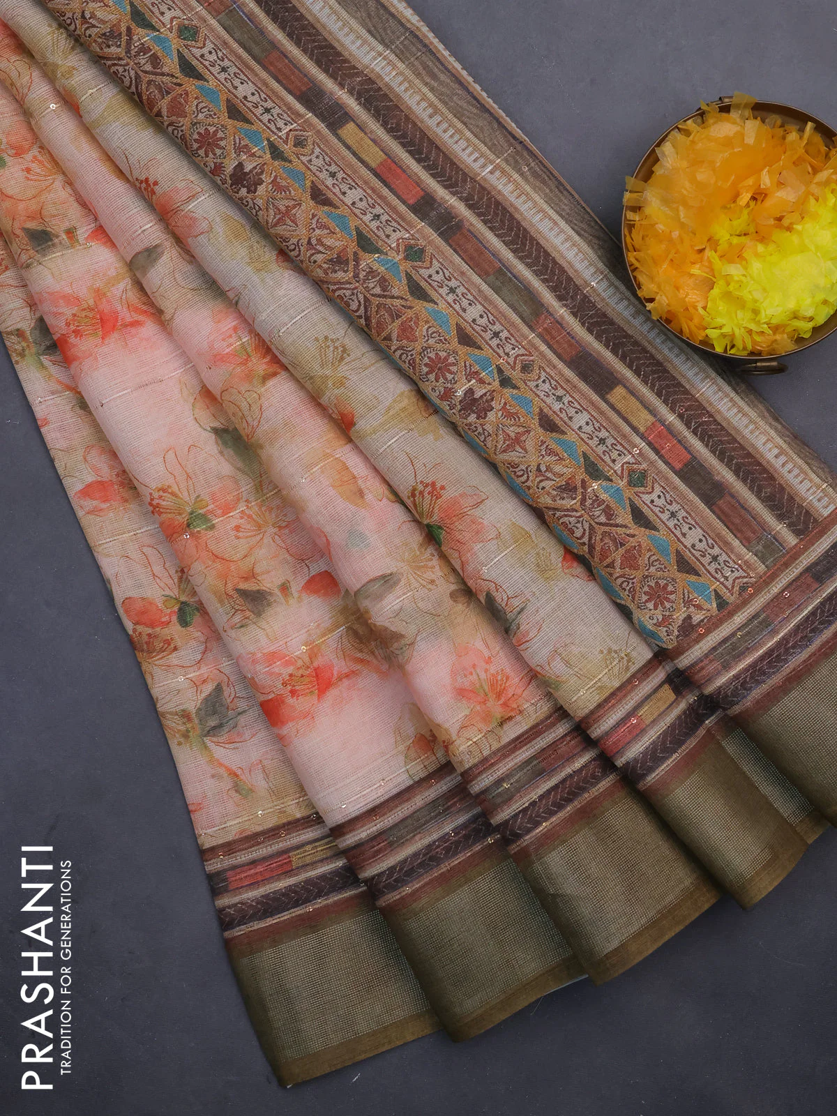 Linen cotton saree pale orange and dark sap green with allover floral prints & sequin work and silver zari woven border