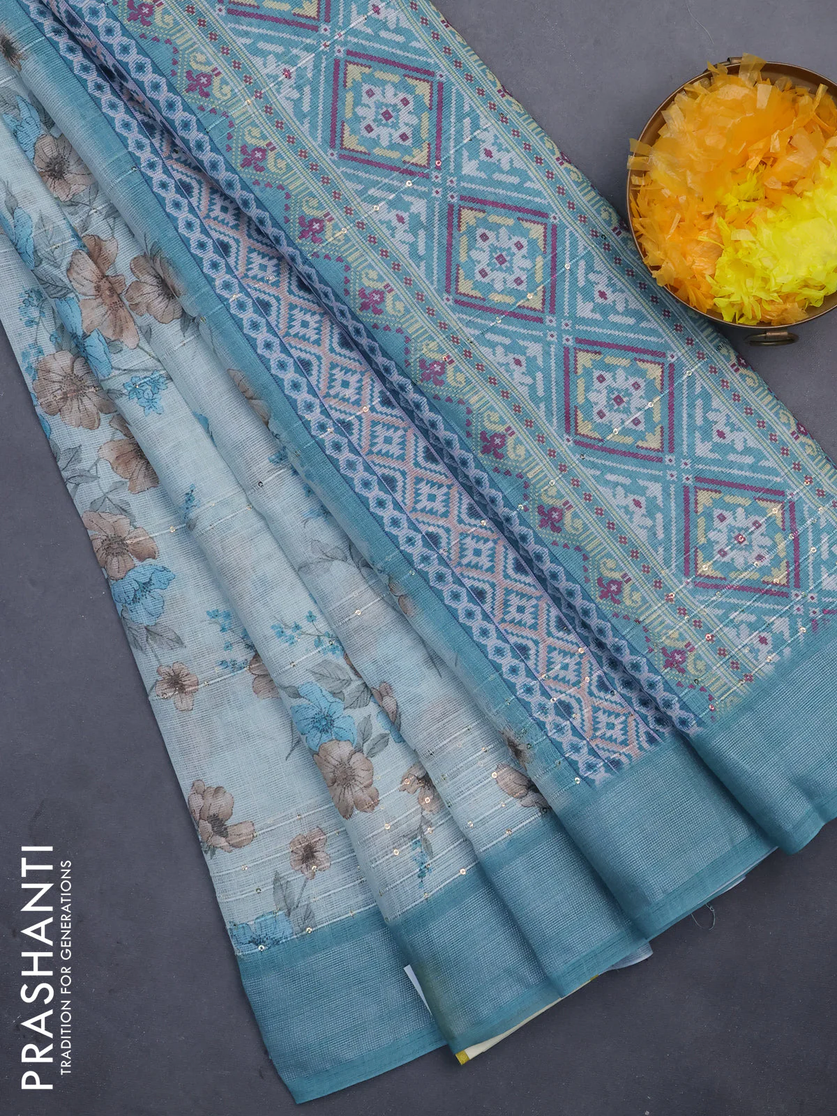Linen cotton saree teal blue shade with floral prints & sequin work and silver zari woven border