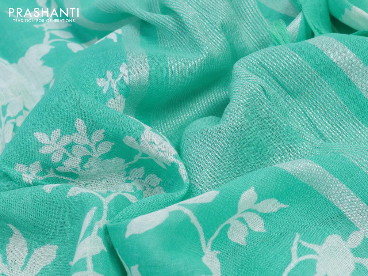 Linen cotton saree teal blue with allover floral prints and small silver zari woven border - Image 6