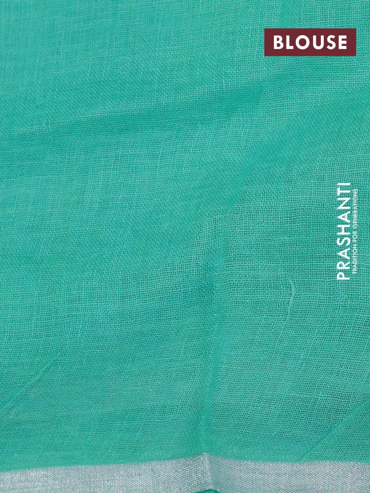 Linen cotton saree teal blue with allover floral prints and small silver zari woven border - Image 7