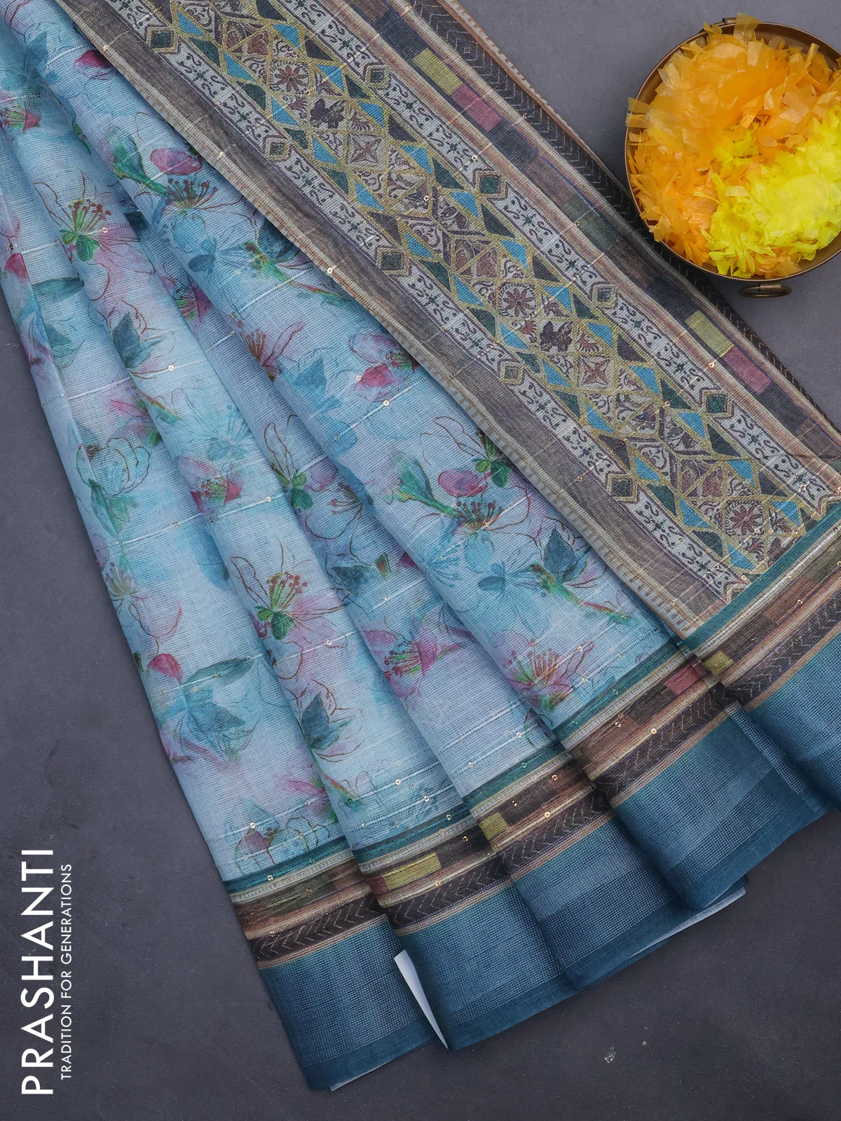 Linen cotton saree teal blue with allover floral prints & sequin work and silver zari woven border
