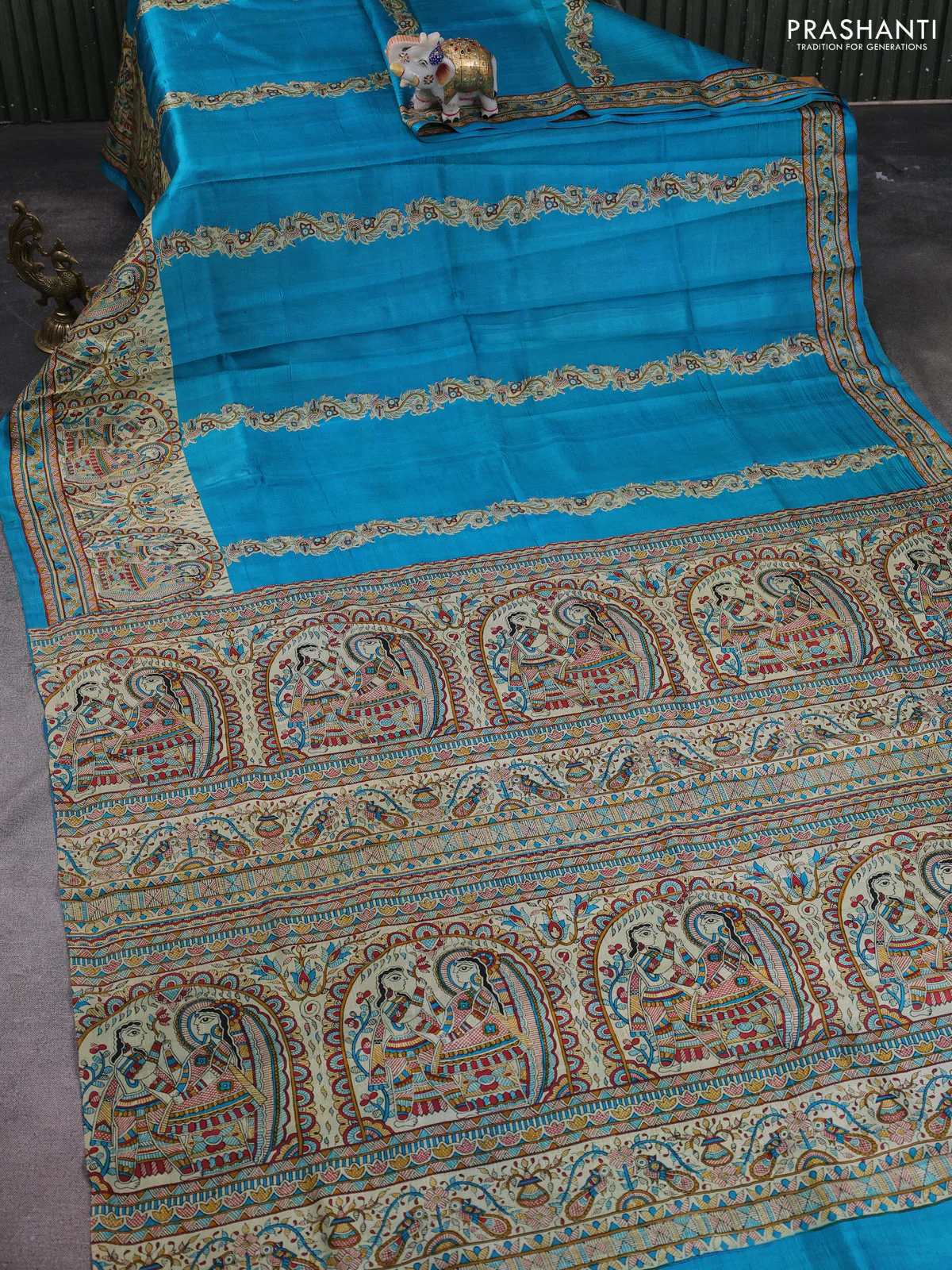 Madhubani printed silk saree teal blue and cream with butta prints and madhubani printed border - Image 2