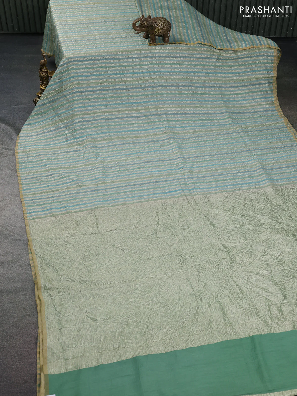 Munga silk saree pastel blue with allover zari woven stripes pattern in borderless style - Image 2