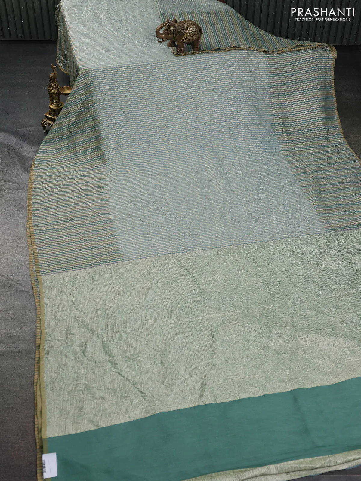 Munga silk saree pastel blue with allover zari woven stripes pattern in borderless style - Image 2