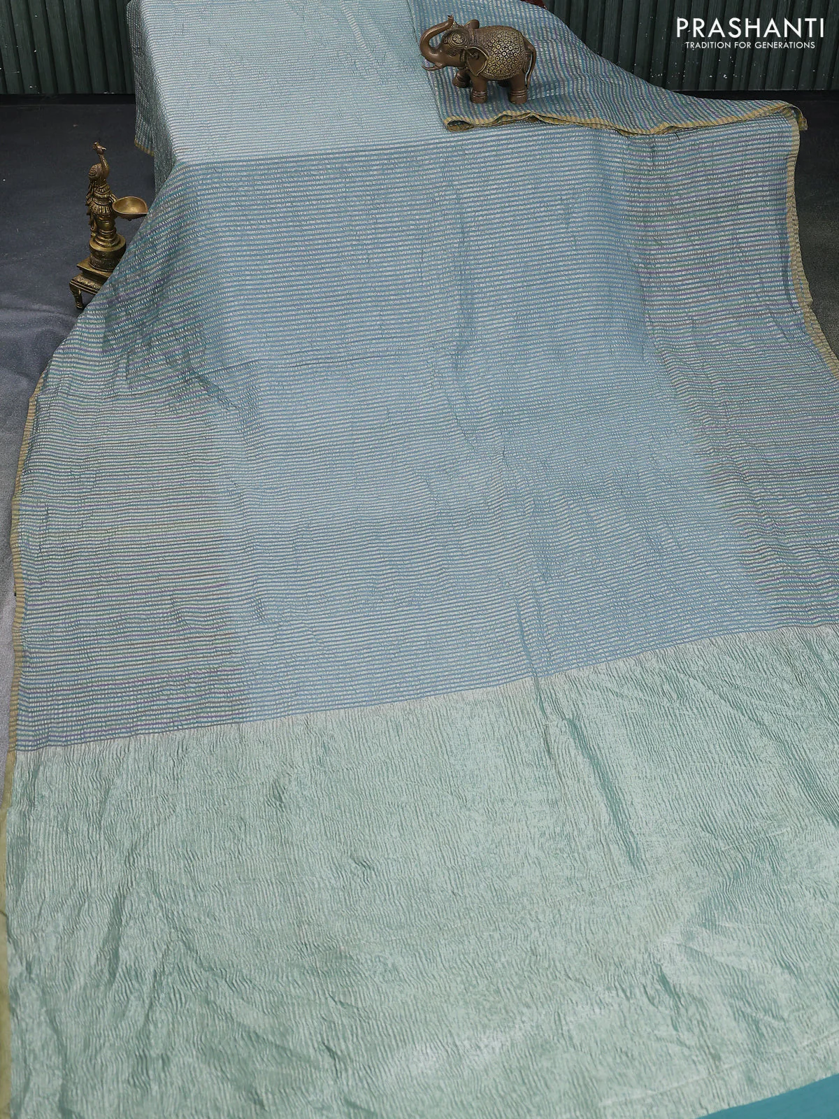 Munga silk saree pastel blue with allover zari woven stripes pattern in borderless style - Image 2