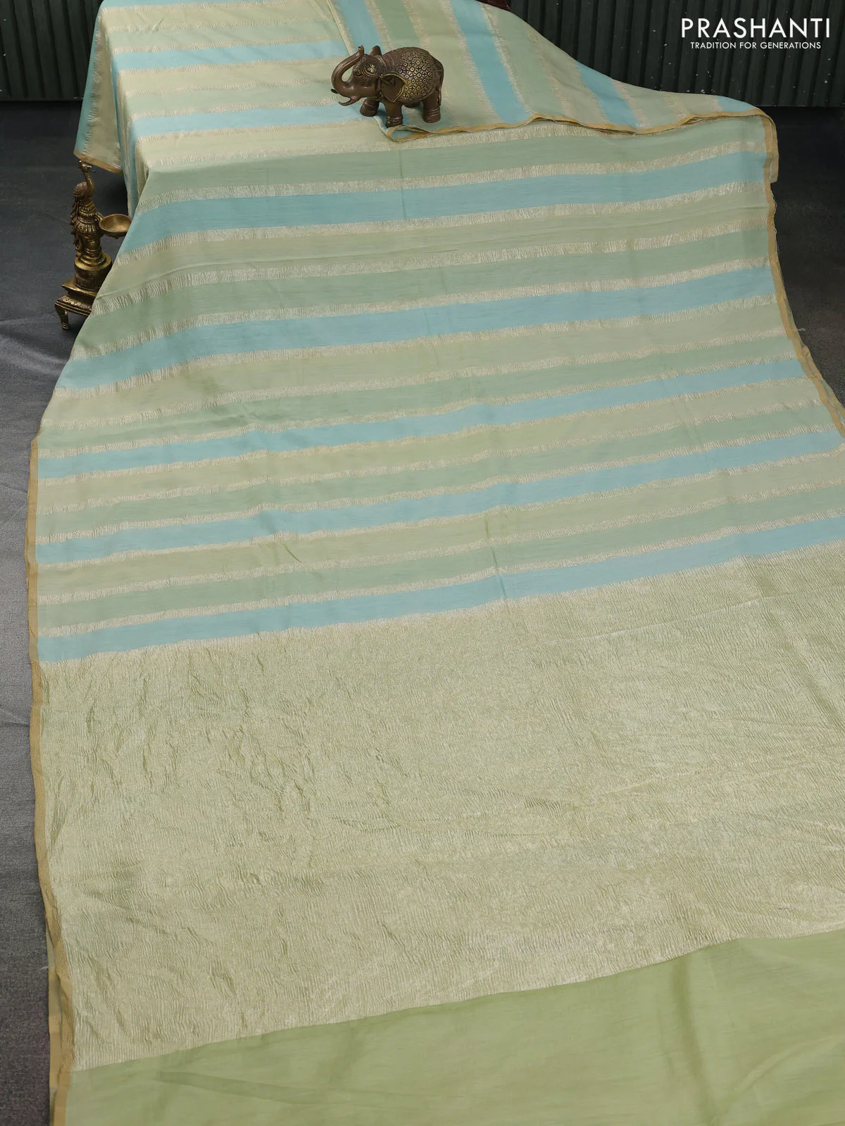 Munga silk saree pastel green and pastel blue with allover zari woven stripes pattern in borderless style - Image 2