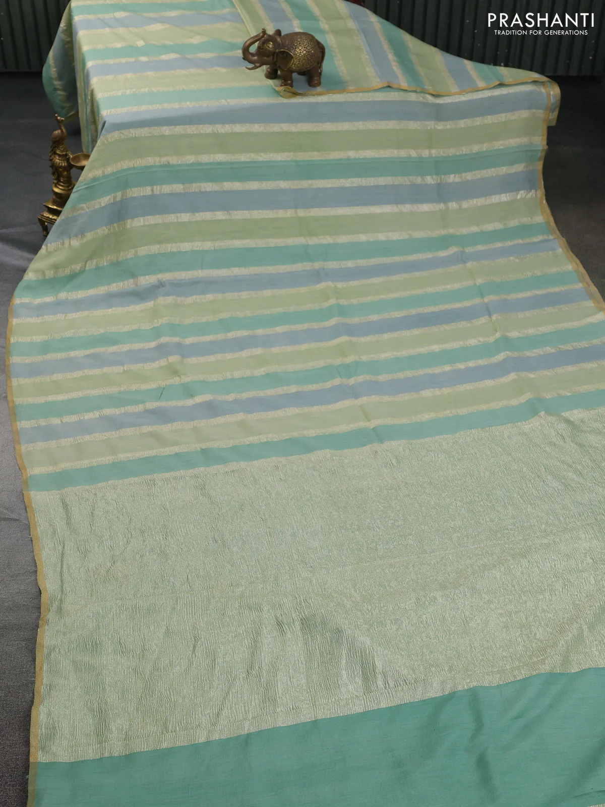 Munga silk saree pastel green and pastel blue with allover zari woven stripes pattern in borderless style - Image 2