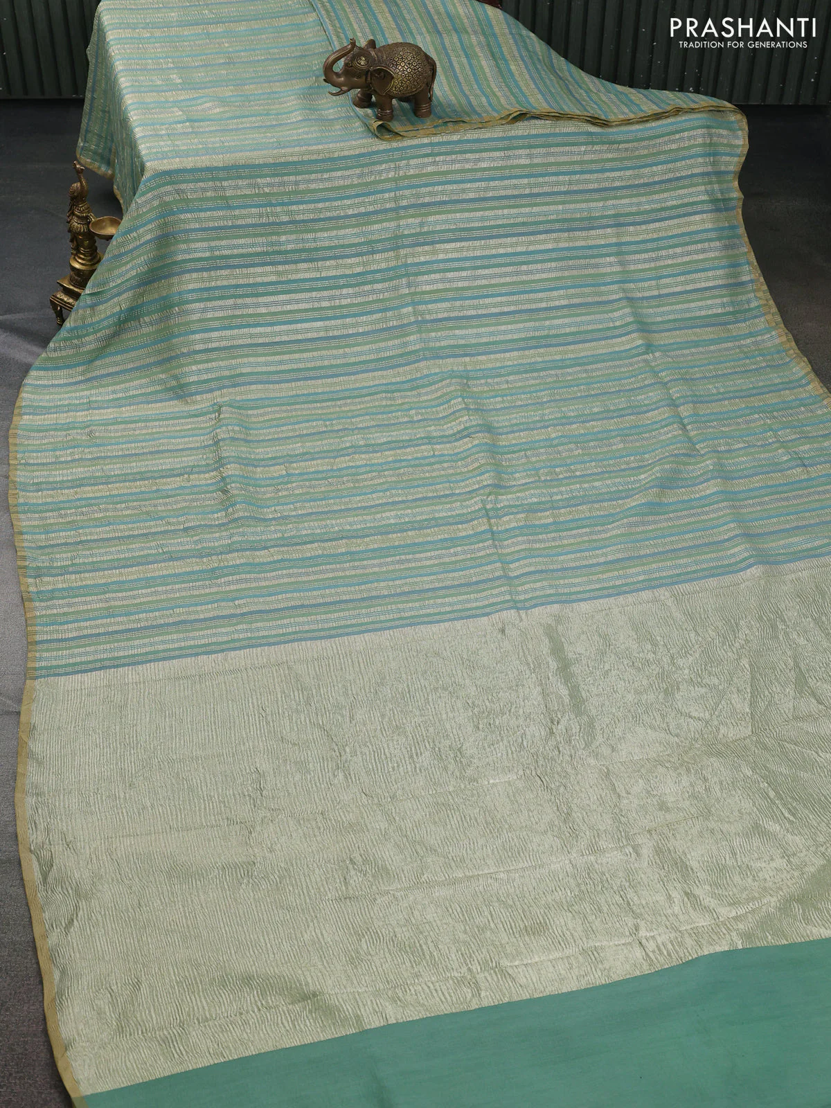 Munga silk saree pastel green and pastel blue with allover zari woven stripes pattern in borderless style - Image 2