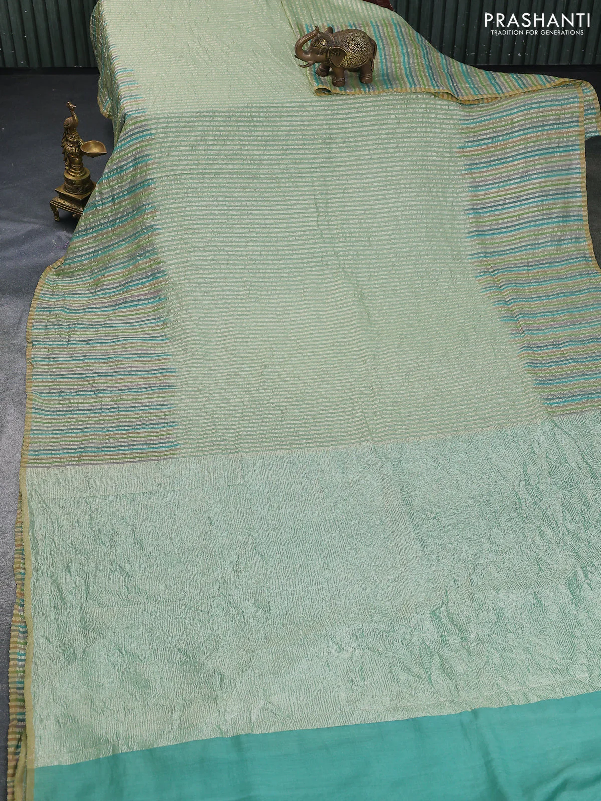 Munga silk saree pastel green with allover zari woven stripes pattern in borderless style - Image 2