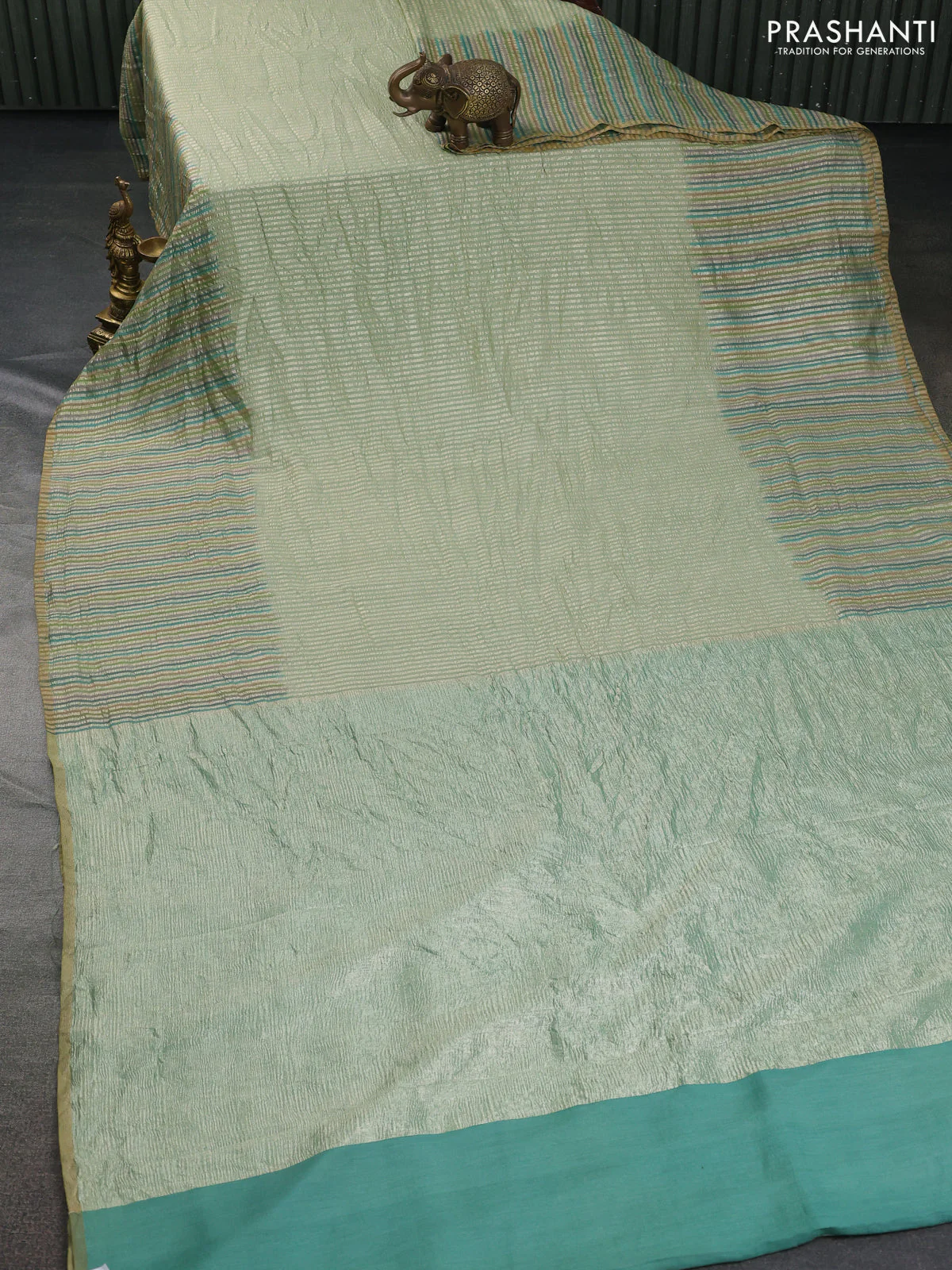 Munga silk saree pastel green with allover zari woven stripes pattern in borderless style - Image 2