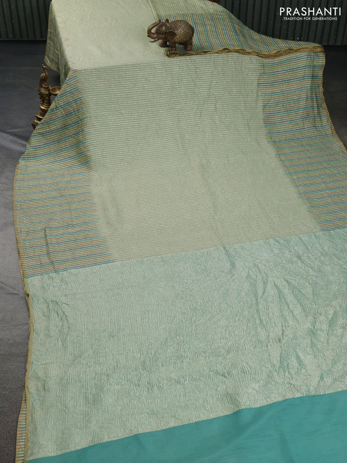 Munga silk saree pastel green with allover zari woven stripes pattern in borderless style - Image 2