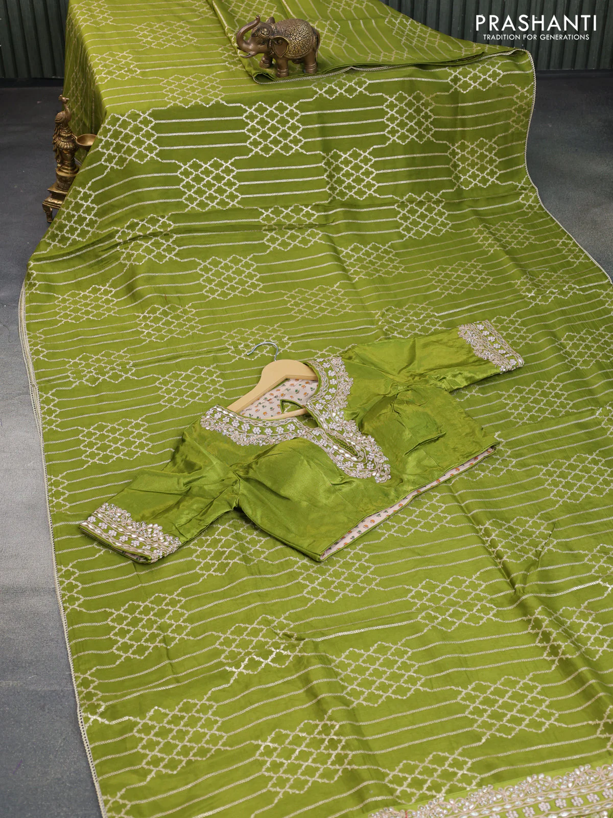 Munga tussar saree mehendi green with allover zari weaves and lace work blue