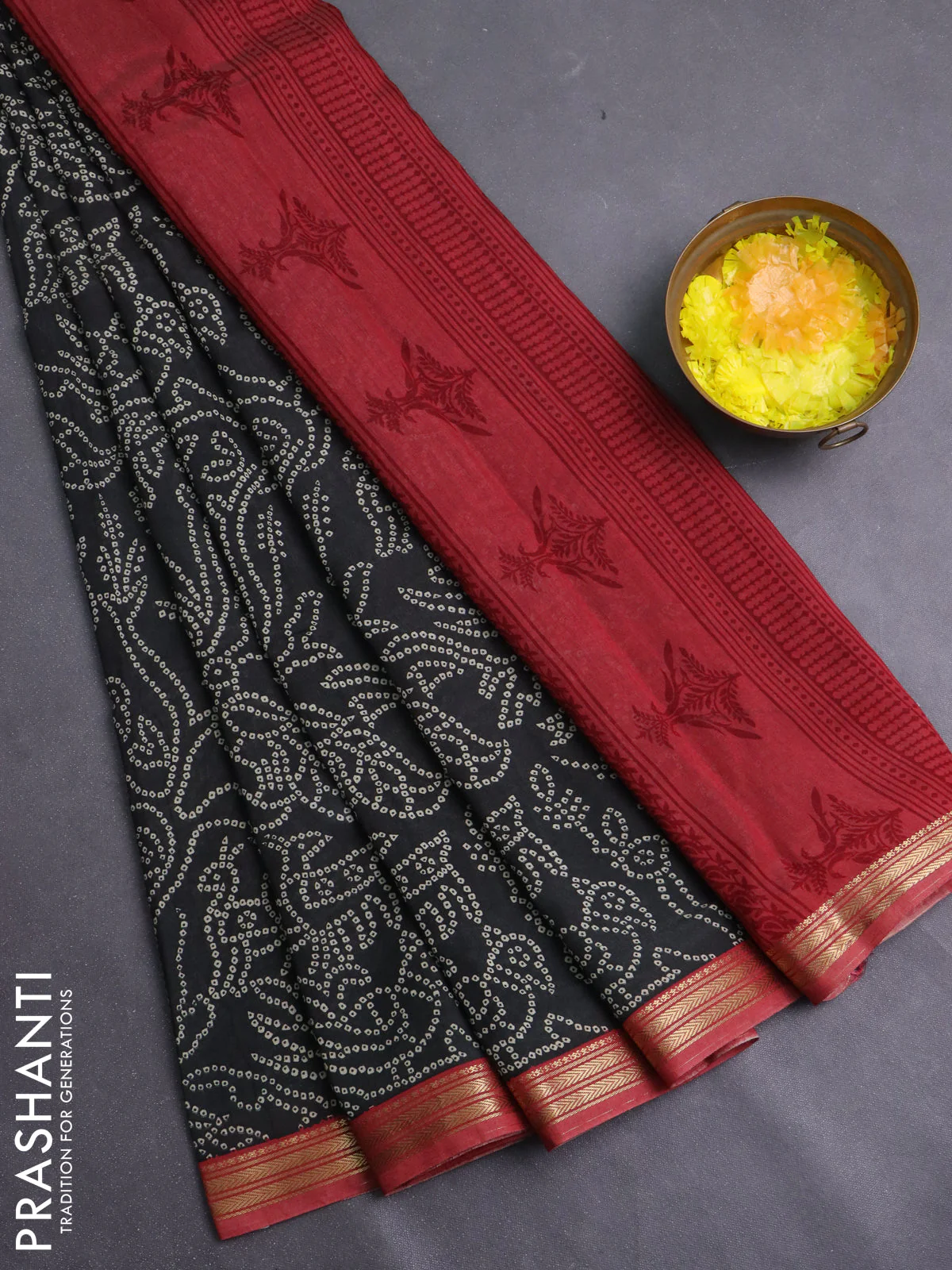 Muslin silk saree black and maroon with allover bandhani prints and zari woven border