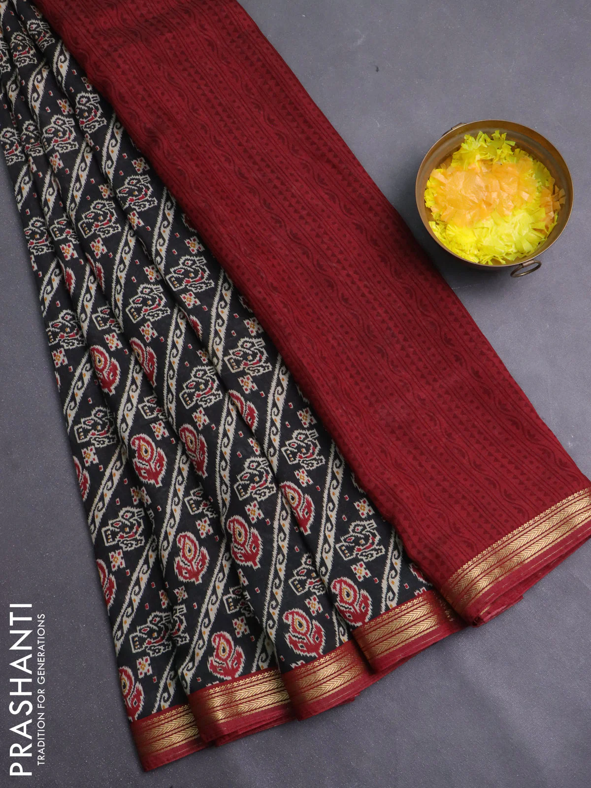 Muslin silk saree black and maroon with allover ikat prints and zari woven border