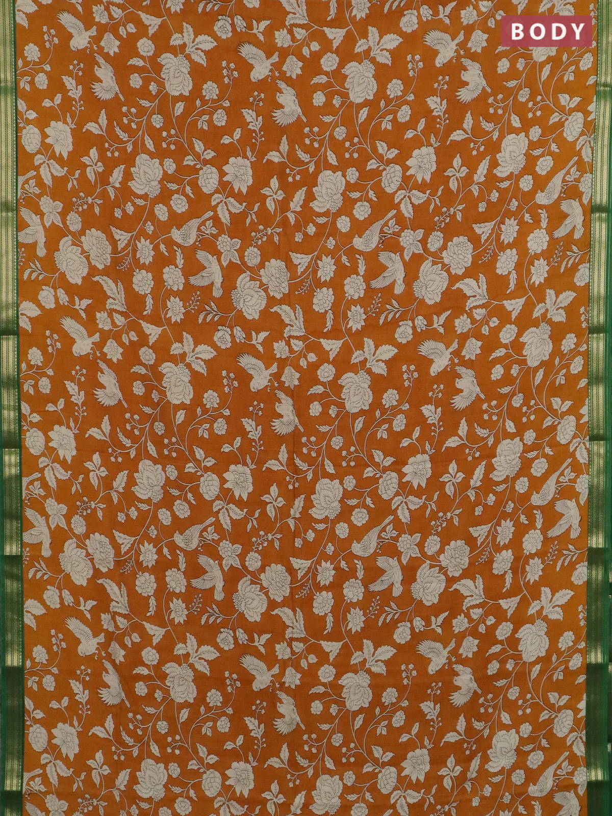 Muslin silk saree dark mustard and green with allover floral prints and zari woven border - Image 2