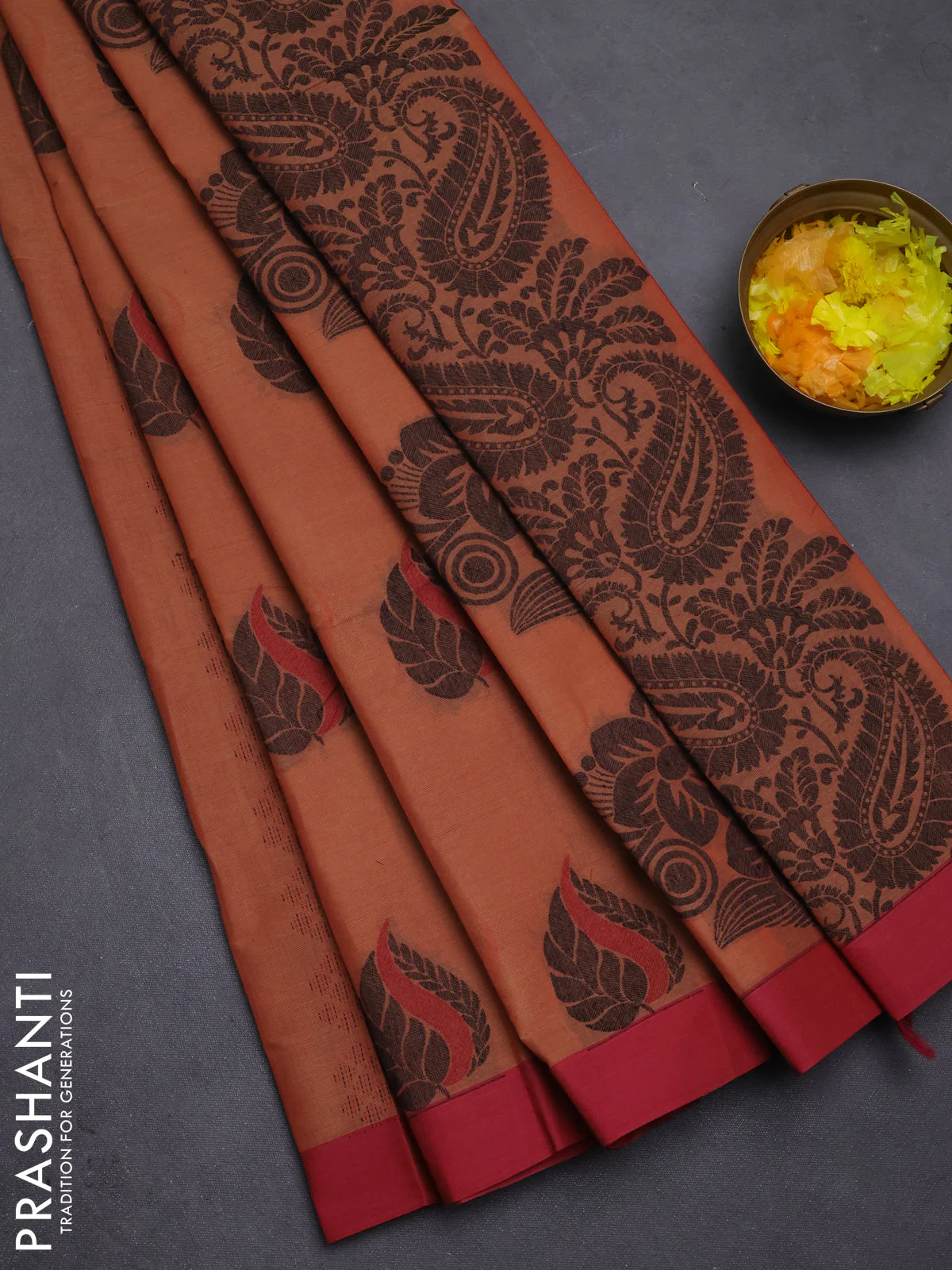 Nithyam cotton saree rust shade and maroon with thread woven buttas and simple border