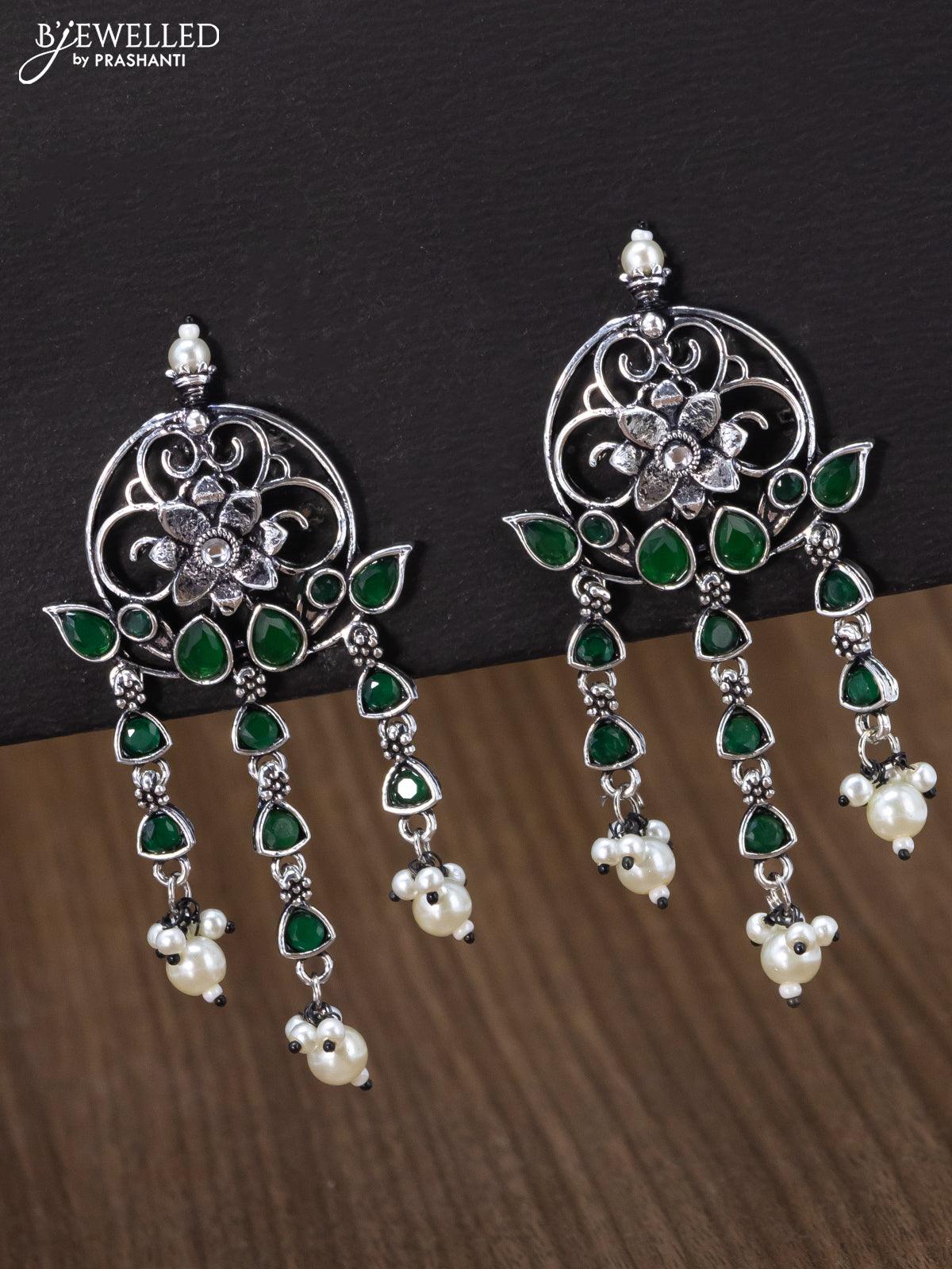 Oxidised earring floral design with emerald stone and pearl hangings