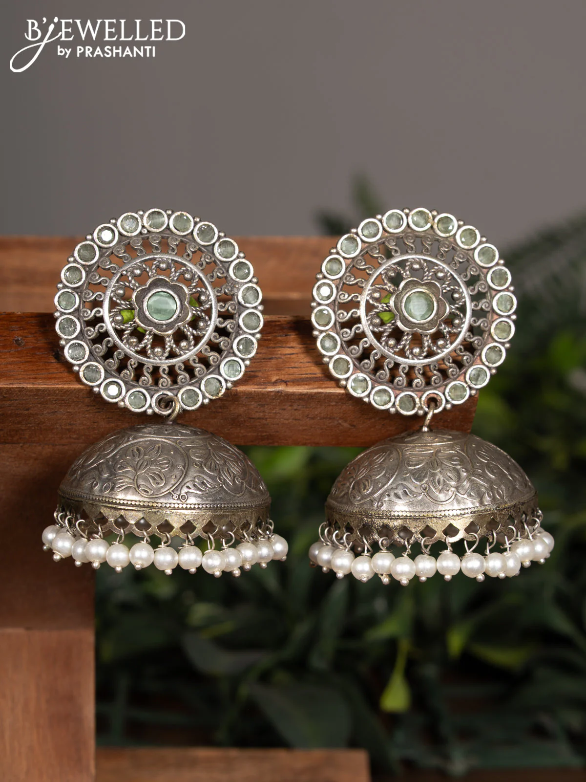 Oxidised jhumka with mint green stones and pearl hangings