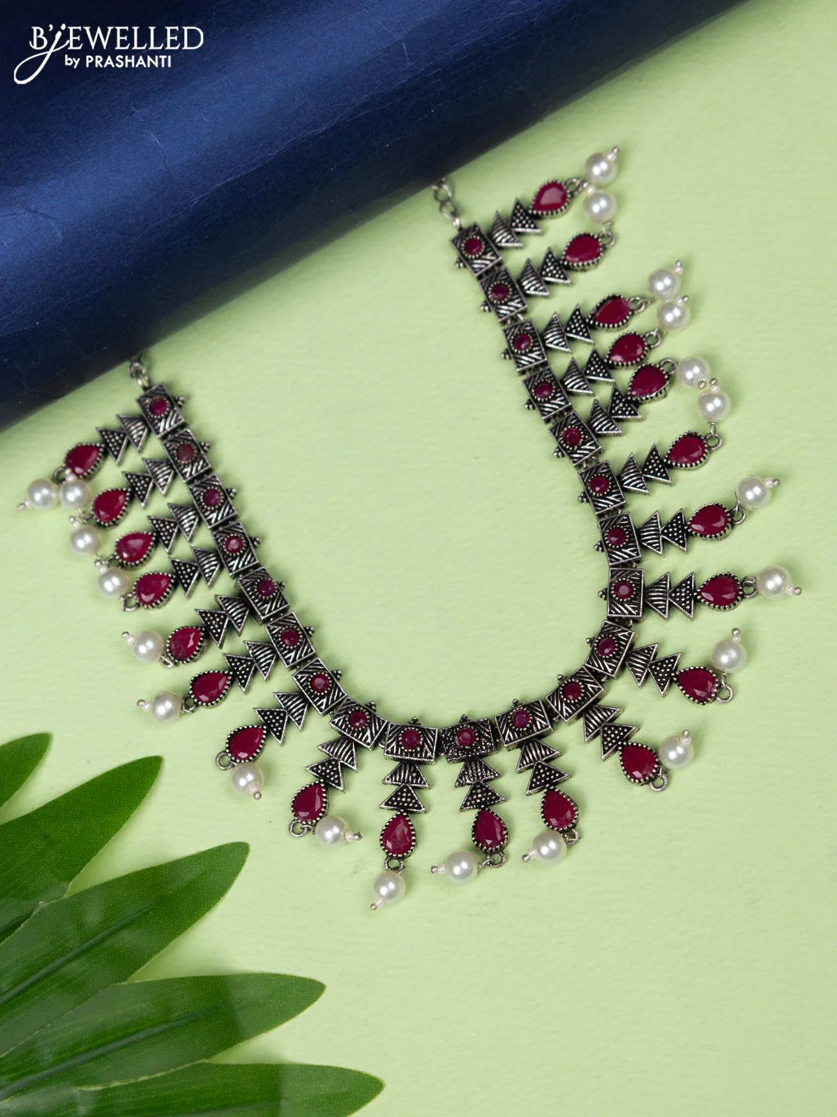 Oxidised necklace with ruby stones and pearl hangings without earring