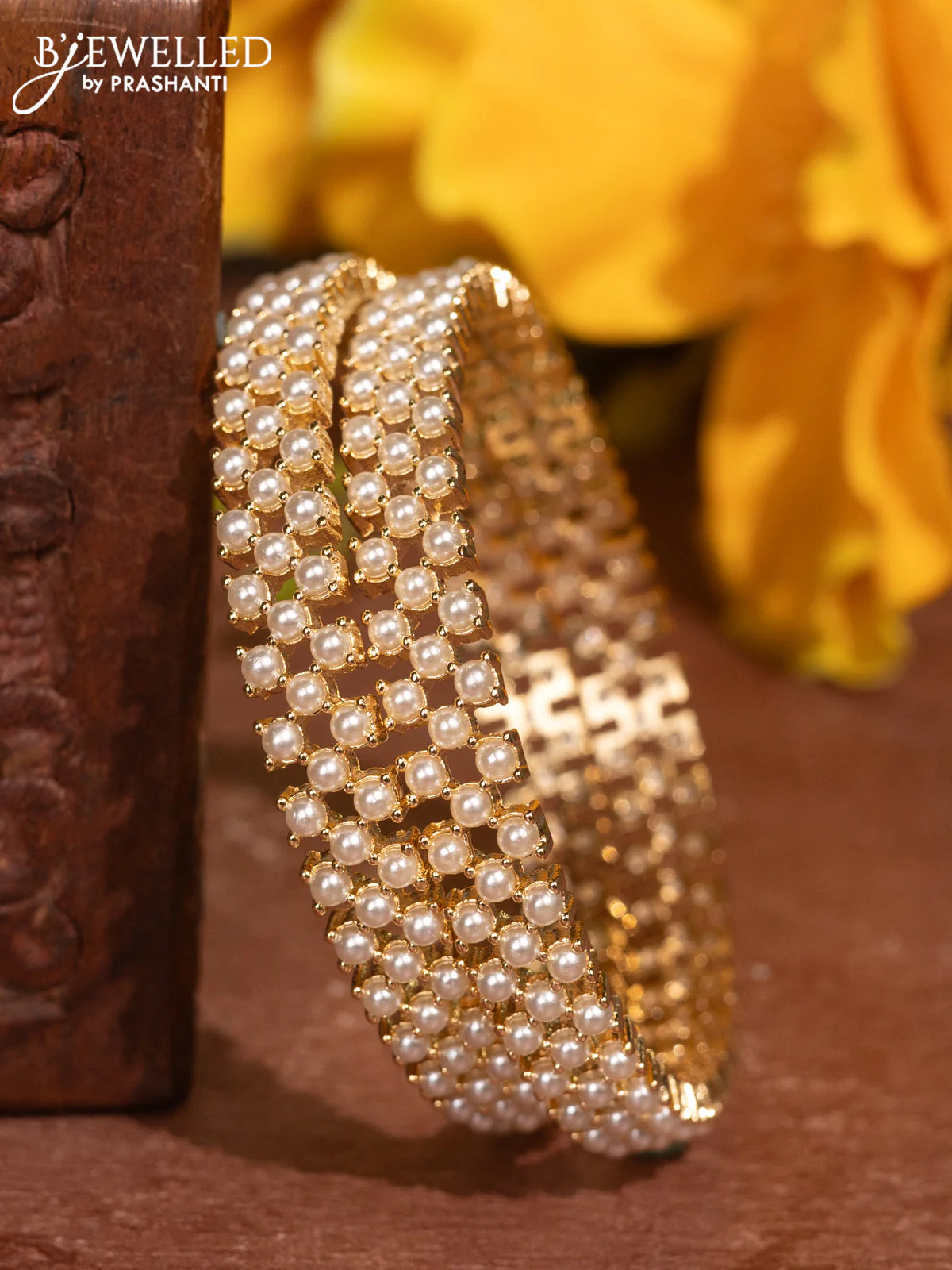 Pearl bangles with and pearls in gold finish