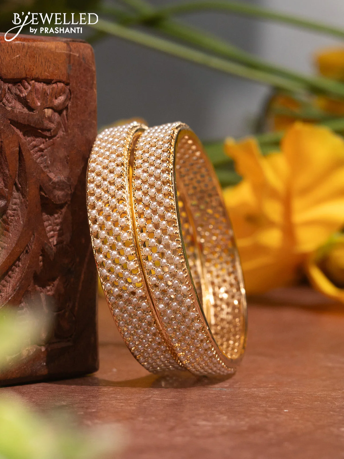 Pearl bangles with and pearls in gold finish