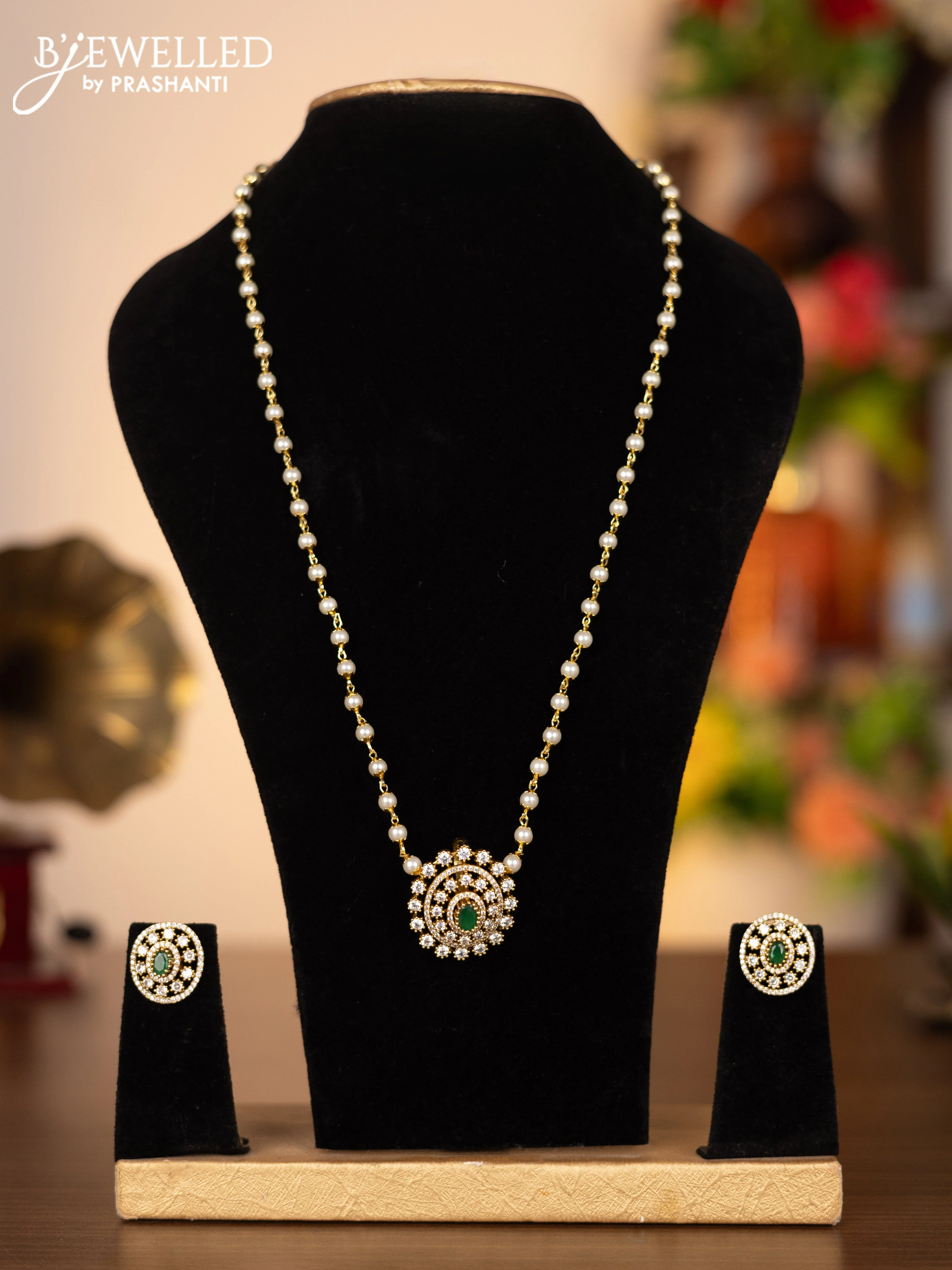Pearl necklace with emerald and cz stones
