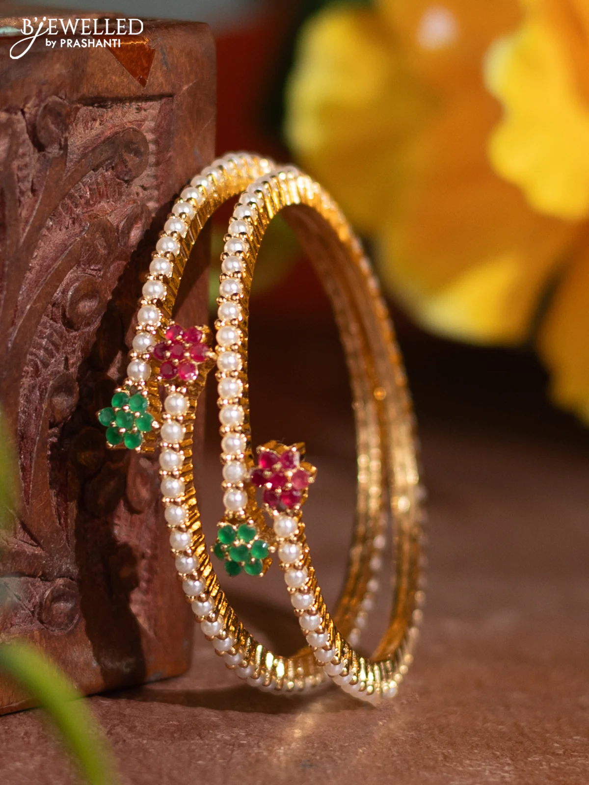 Pearl bangle with kemp stones and pearls in gold finish
