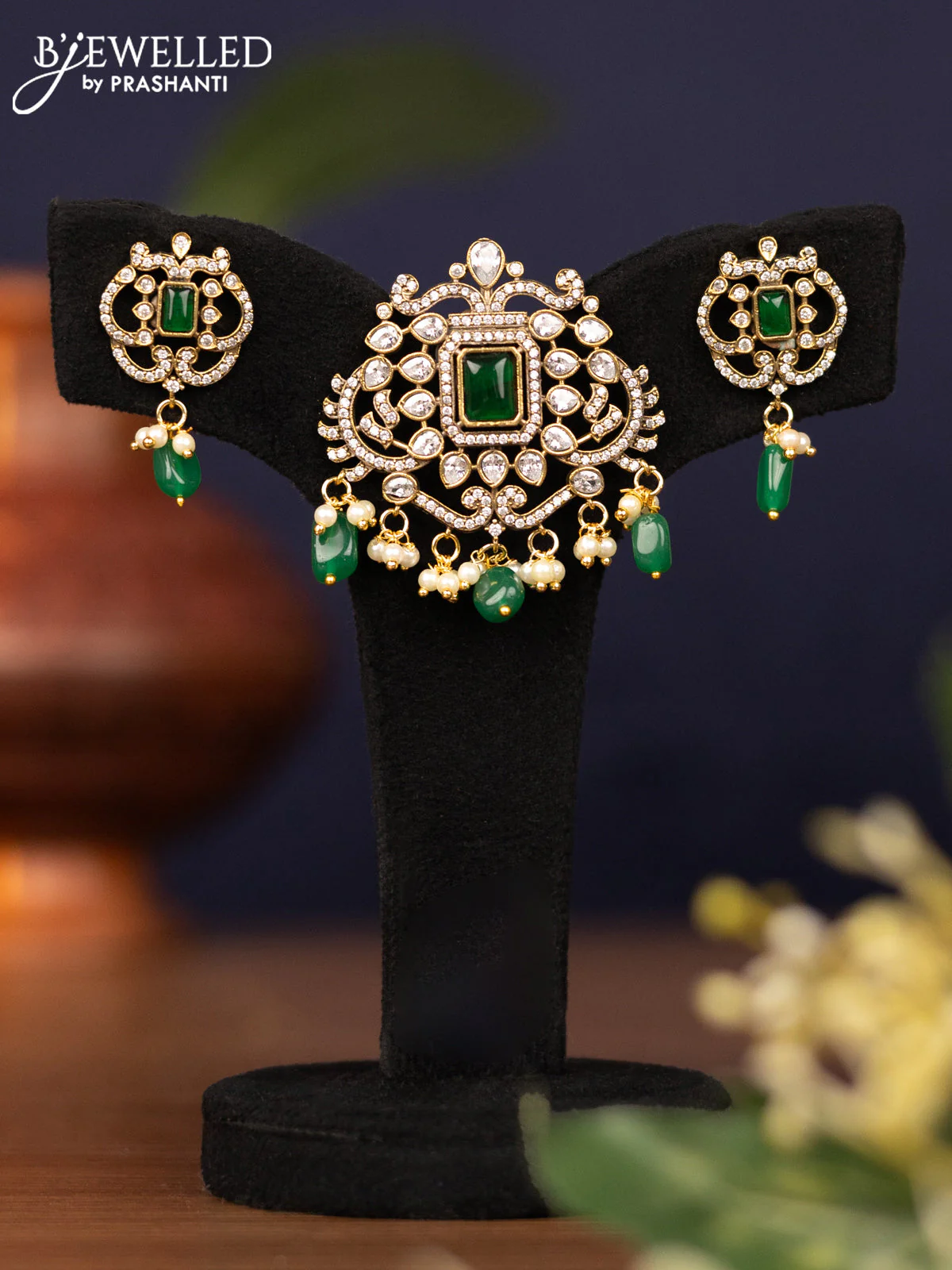 Pendant set with emerald & cz stones and pearl & beads hangings in victorian finish