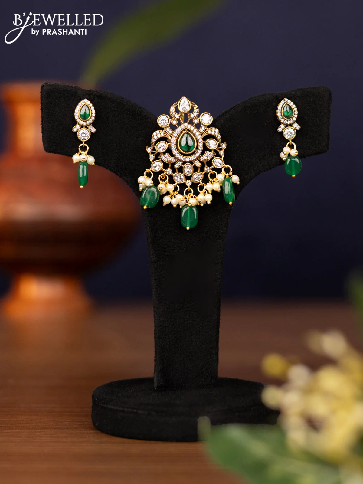Pendant set with emerald & cz stones and pearl & beads hangings in victorian finish