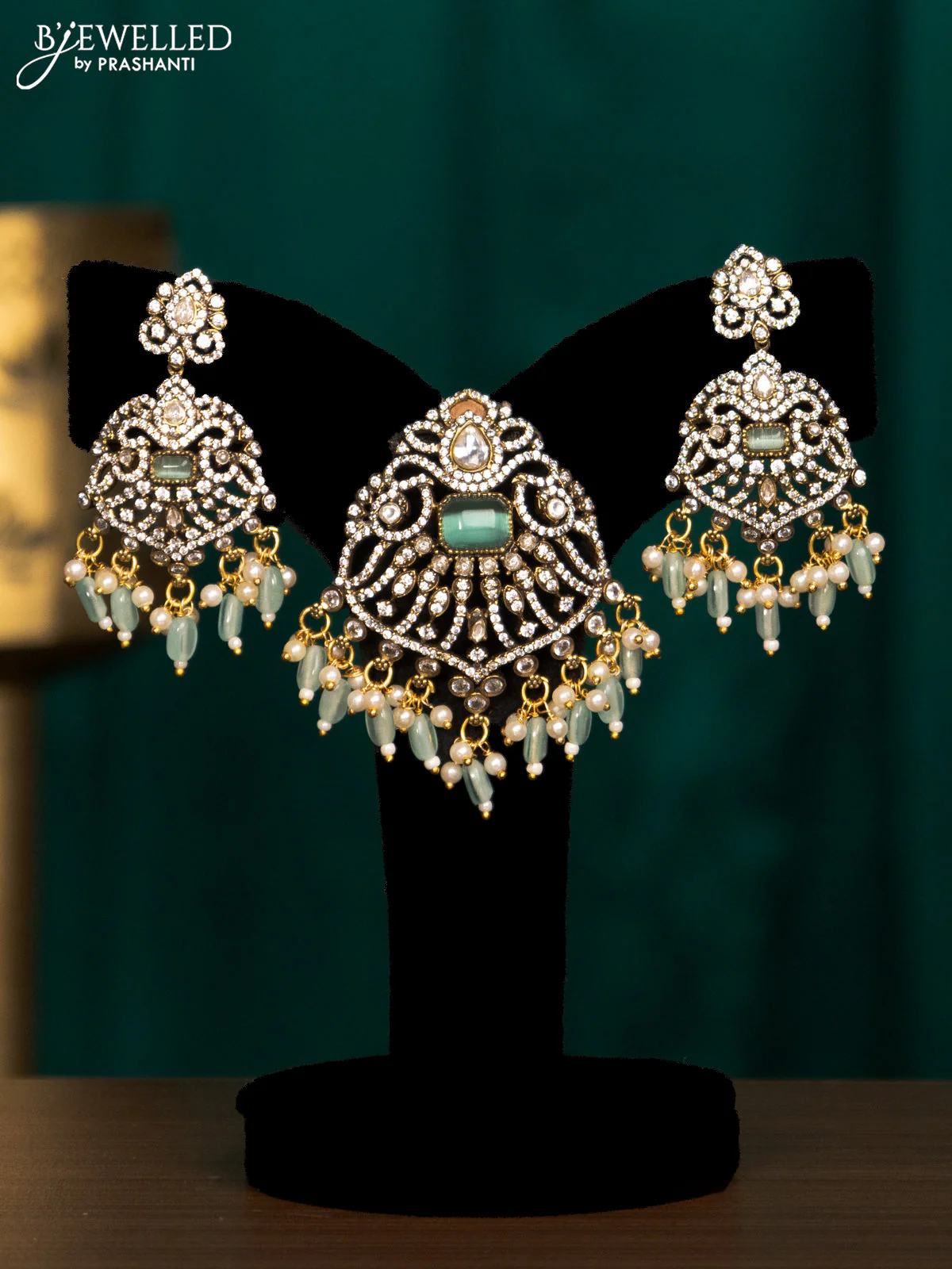 Pendant set with mint green & cz stones and beads hanging in victorian finish
