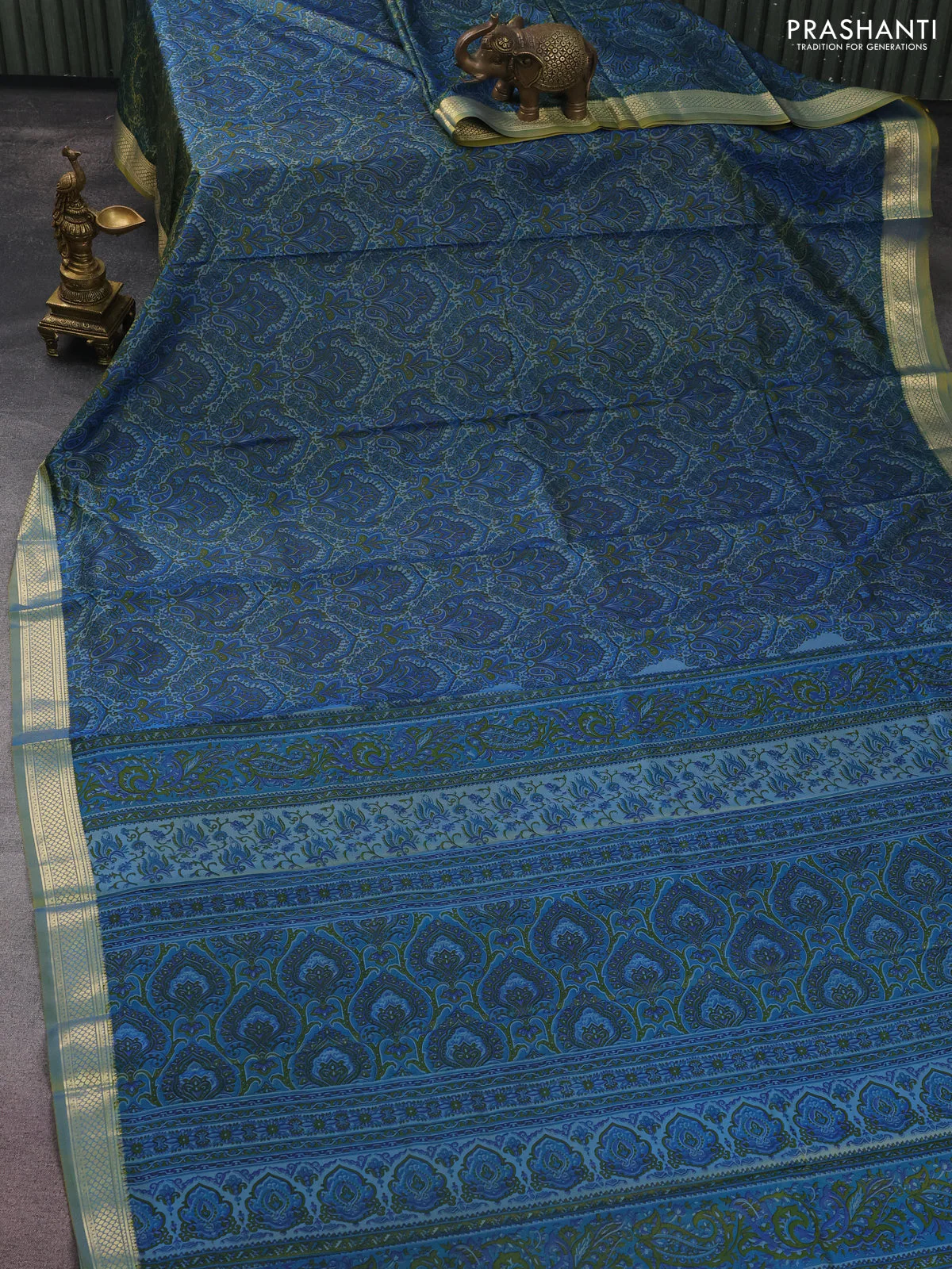 Printed silk saree dual shade of bluish yellow and l with allover prints and zari woven border - Image 2